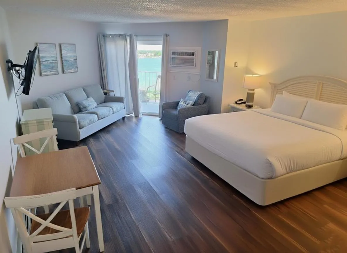 Seating area, Bed in Pointes North Beachfront Hotel - 2 Person Spa Tub Studios