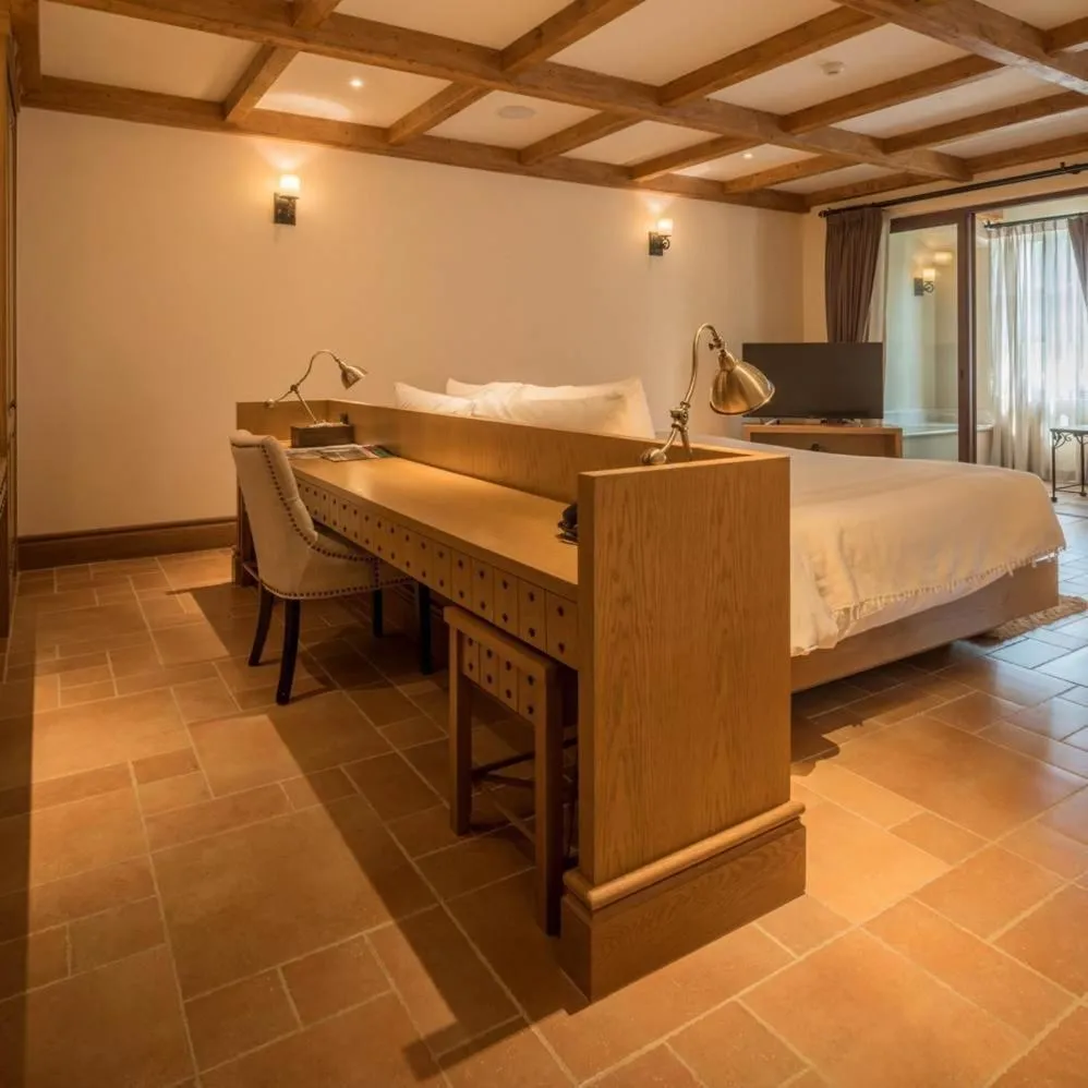 Bed in Toscana Town Square Suites