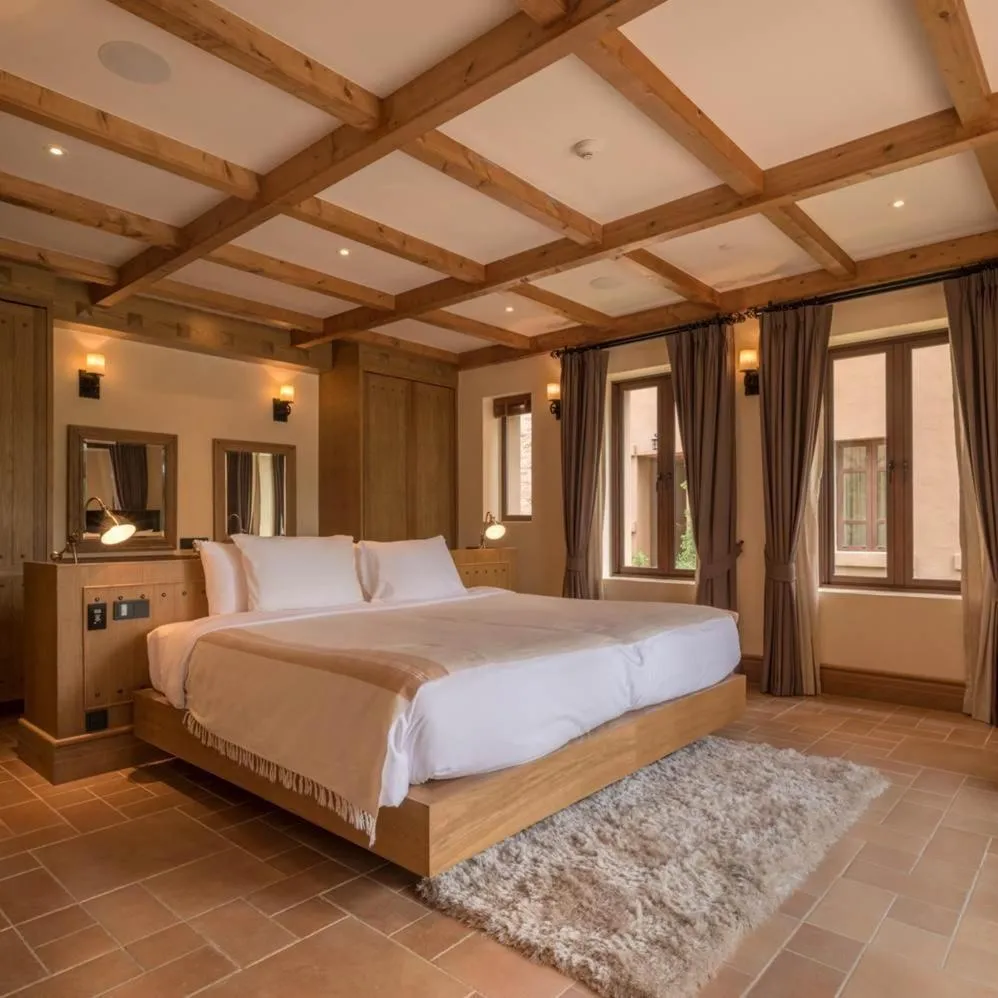 Bed in Toscana Town Square Suites