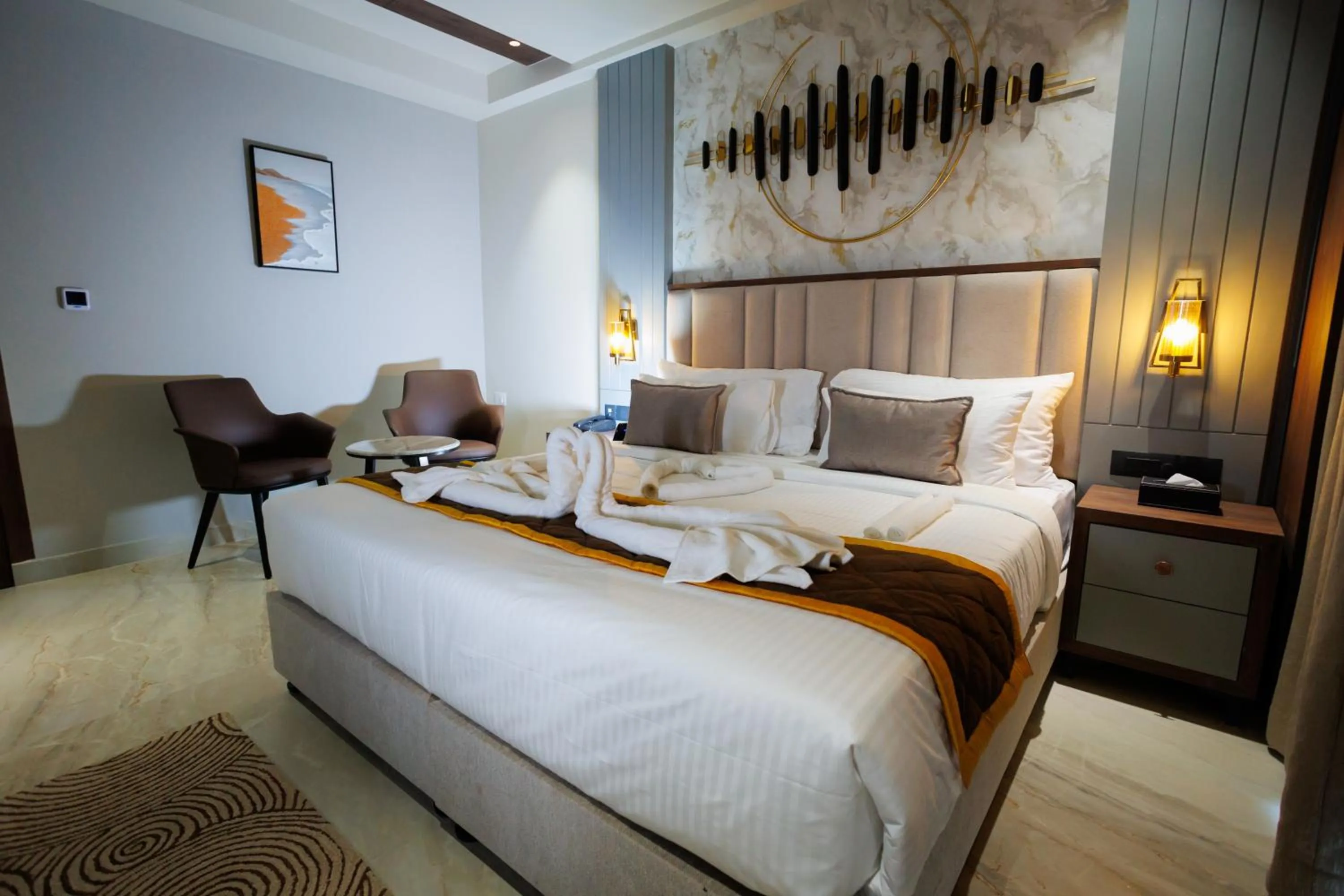 Bed in AJ GRAND ELITE HOTEL