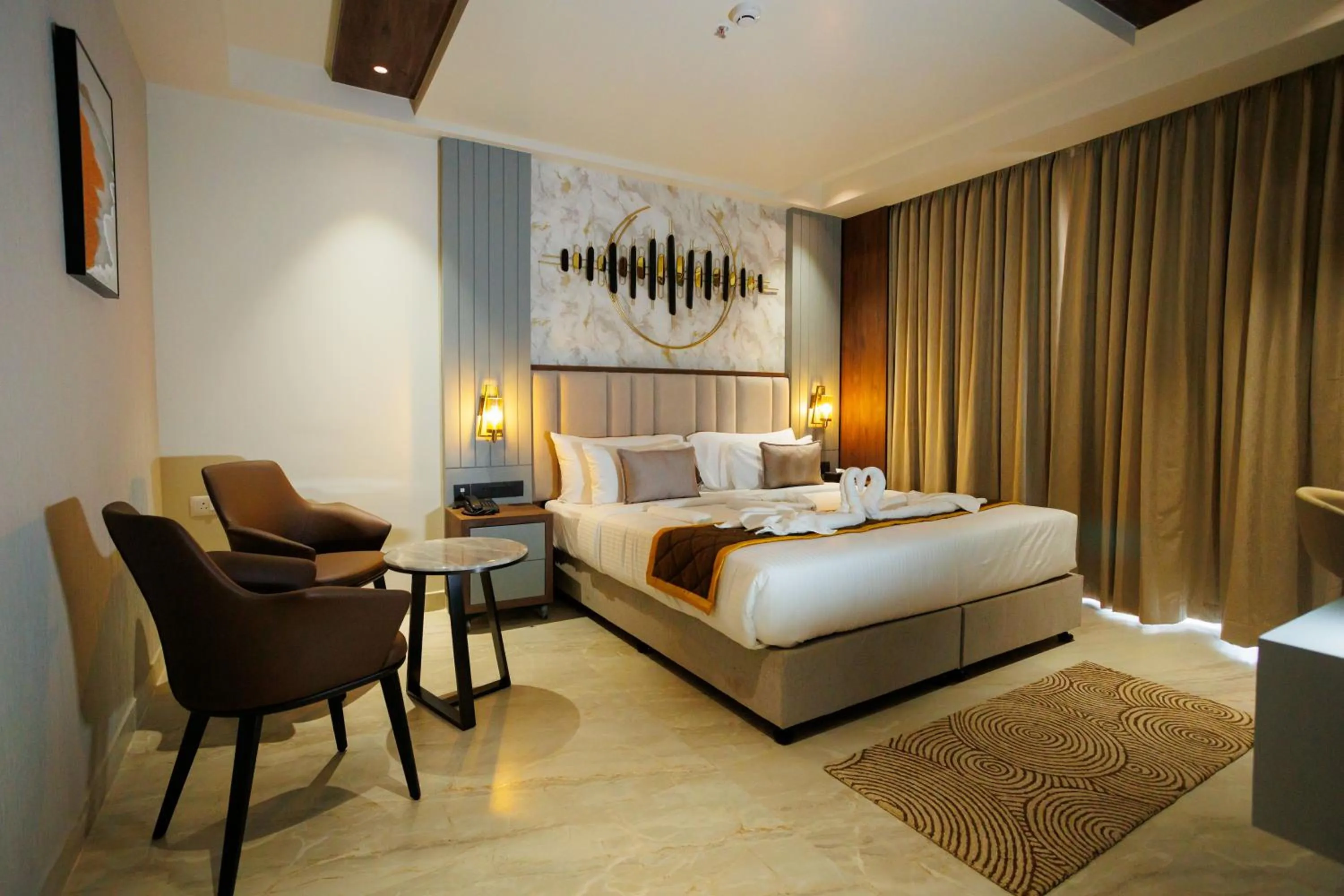 Bed in AJ GRAND ELITE HOTEL