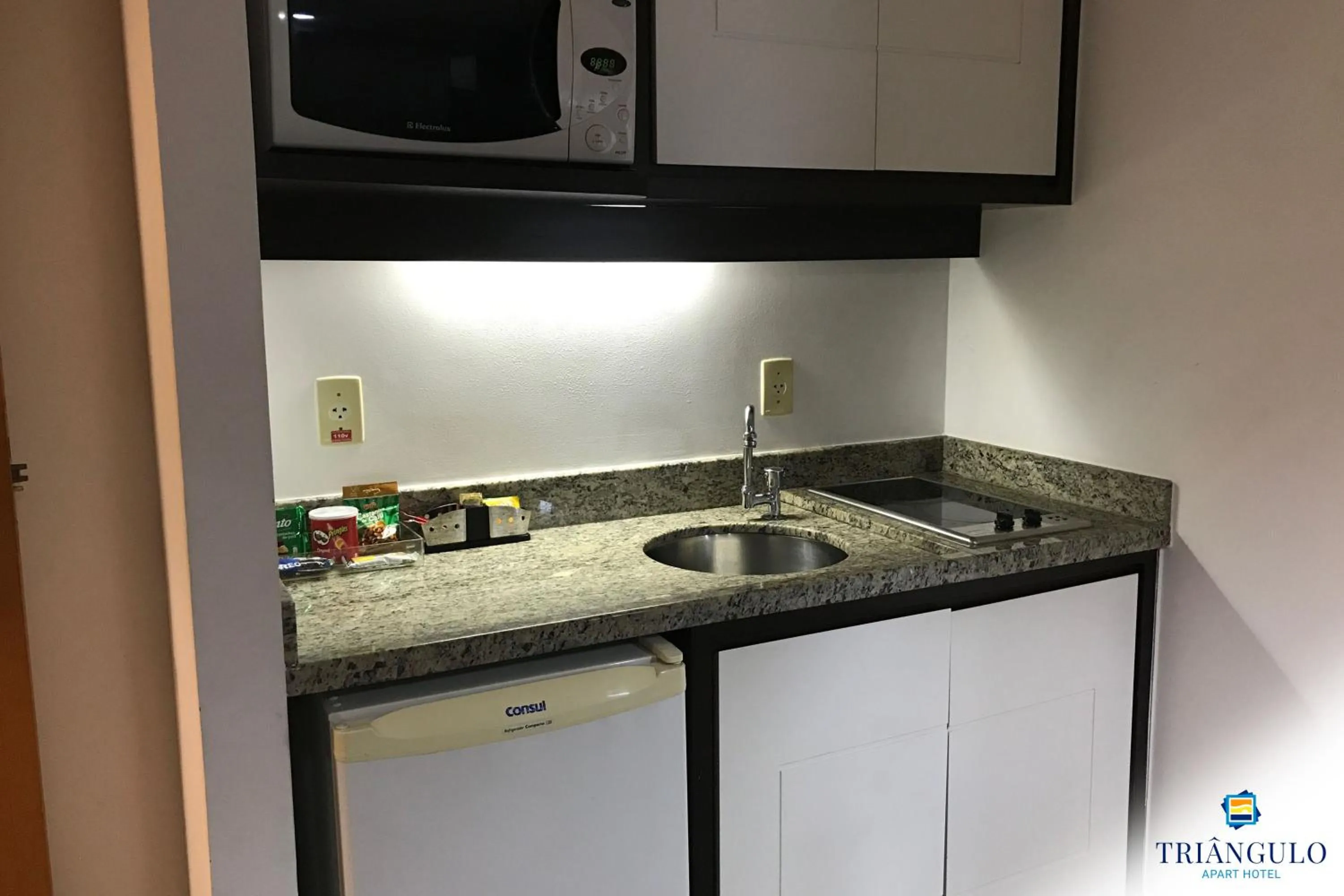 Kitchen or kitchenette in Triângulo Apart Hotel