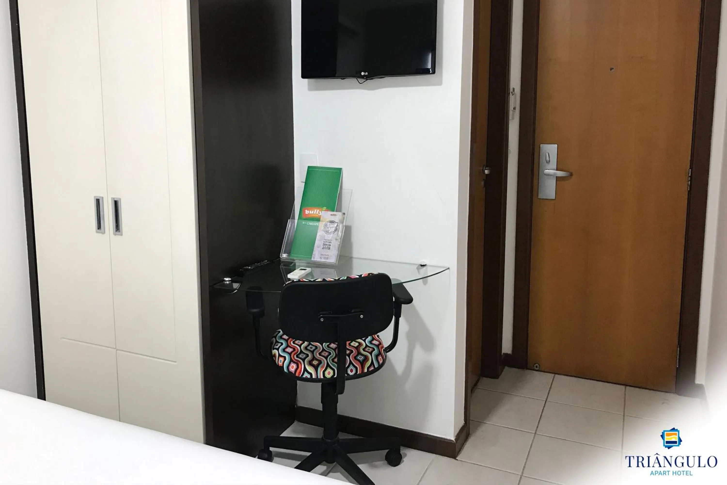 Photo of the whole room in Triângulo Apart Hotel