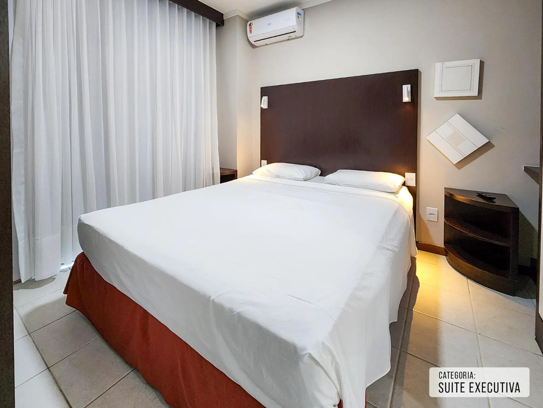 Bed in Triângulo Apart Hotel