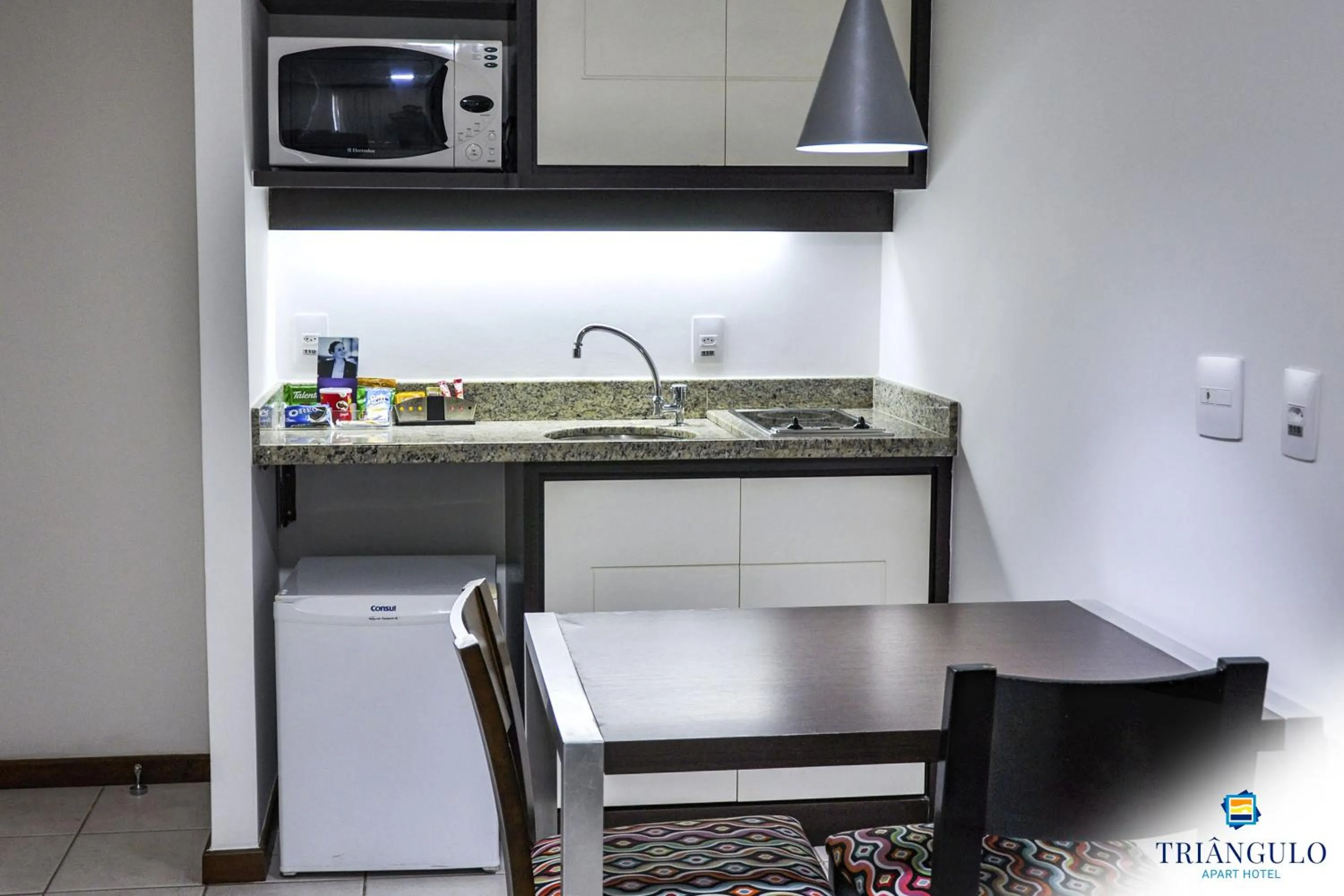 Kitchen or kitchenette in Triângulo Apart Hotel