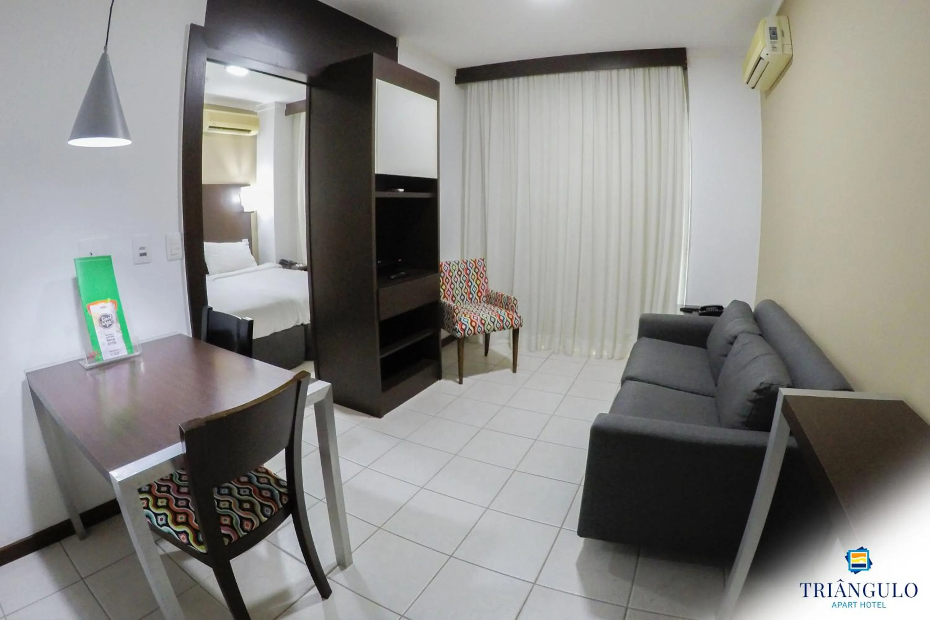 Living room, Bed in Triângulo Apart Hotel