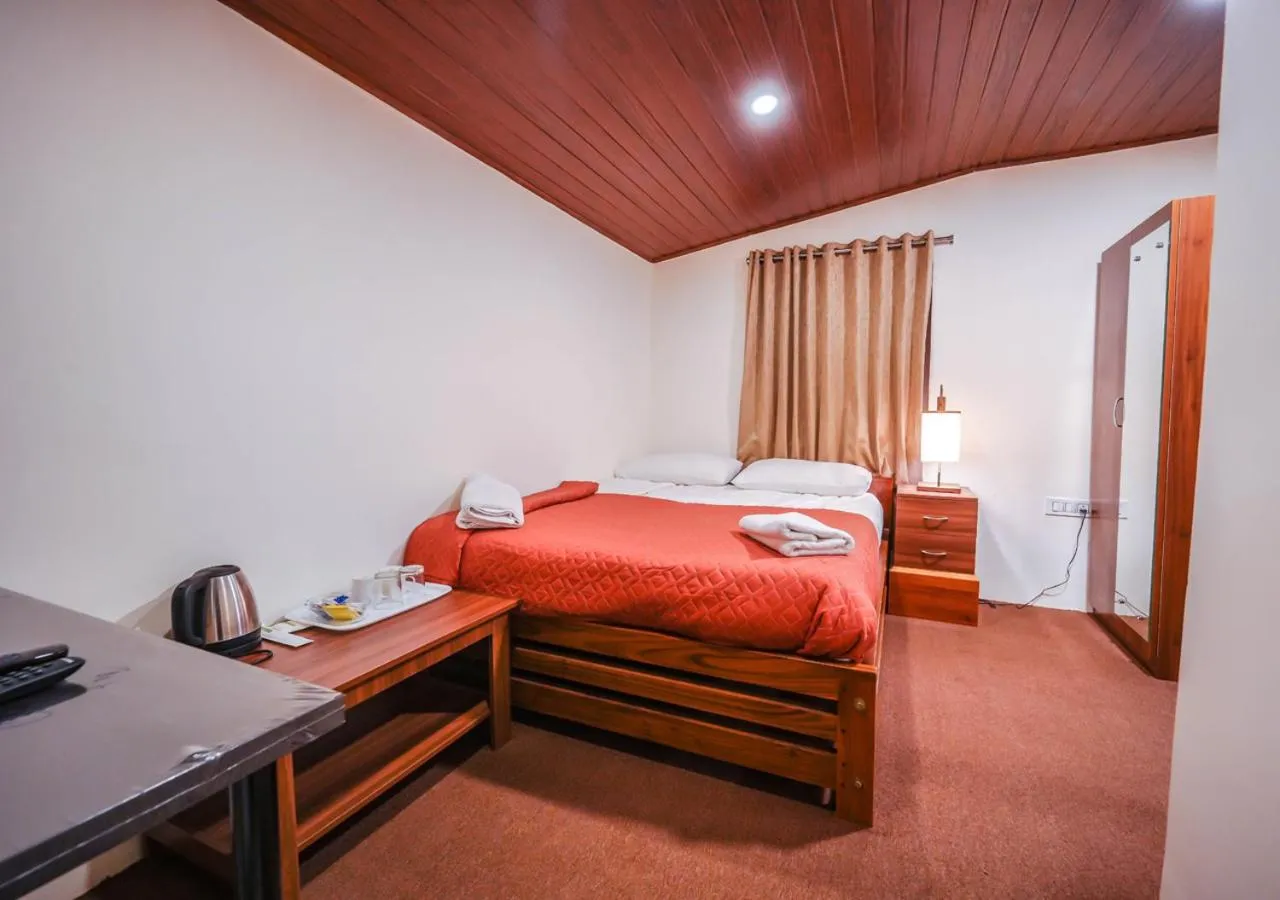 Bed in Lauriston Ooty Town Heritage Bungalow by VOYE HOMES