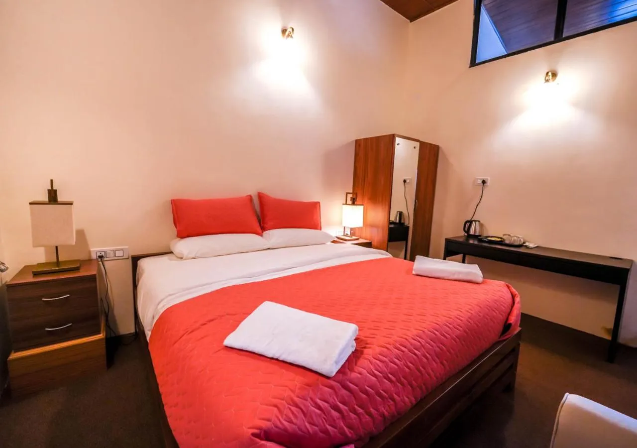 Bed in Lauriston Ooty Town Heritage Bungalow by VOYE HOMES