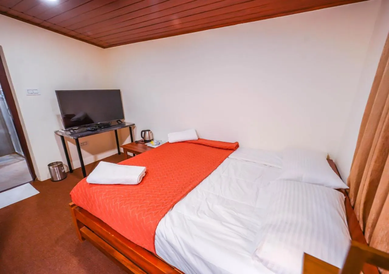 Bed in Lauriston Ooty Town Heritage Bungalow by VOYE HOMES