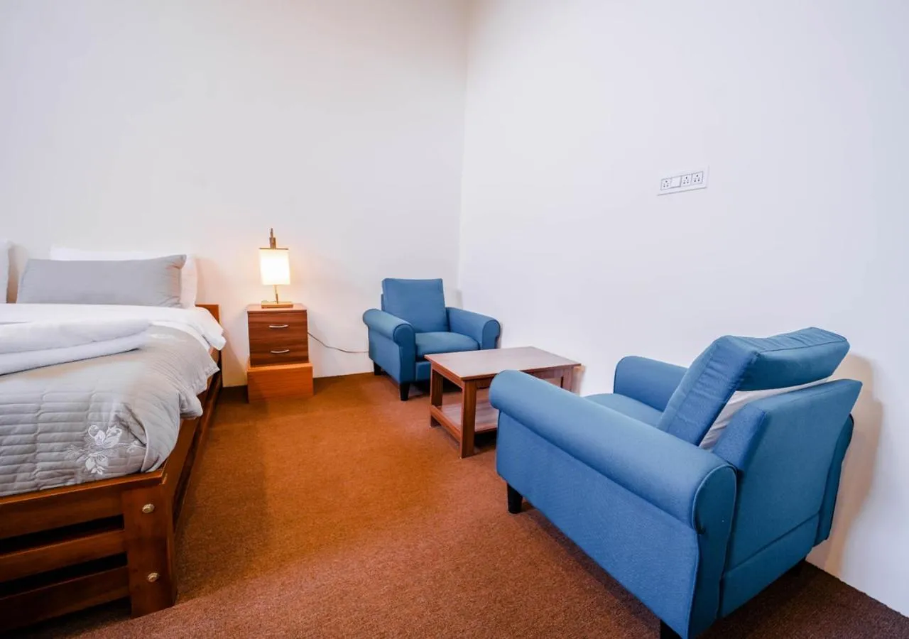 Bed in Lauriston Ooty Town Heritage Bungalow by VOYE HOMES