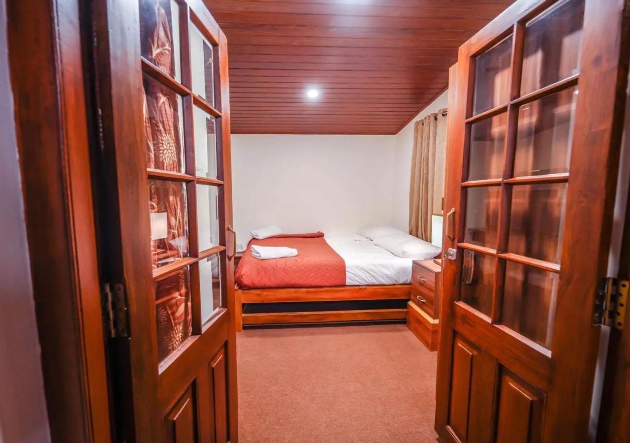 Bed in Lauriston Ooty Town Heritage Bungalow by VOYE HOMES