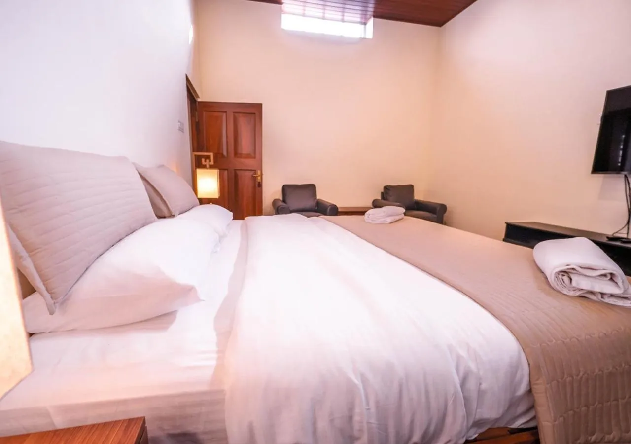 Bed in Lauriston Ooty Town Heritage Bungalow by VOYE HOMES