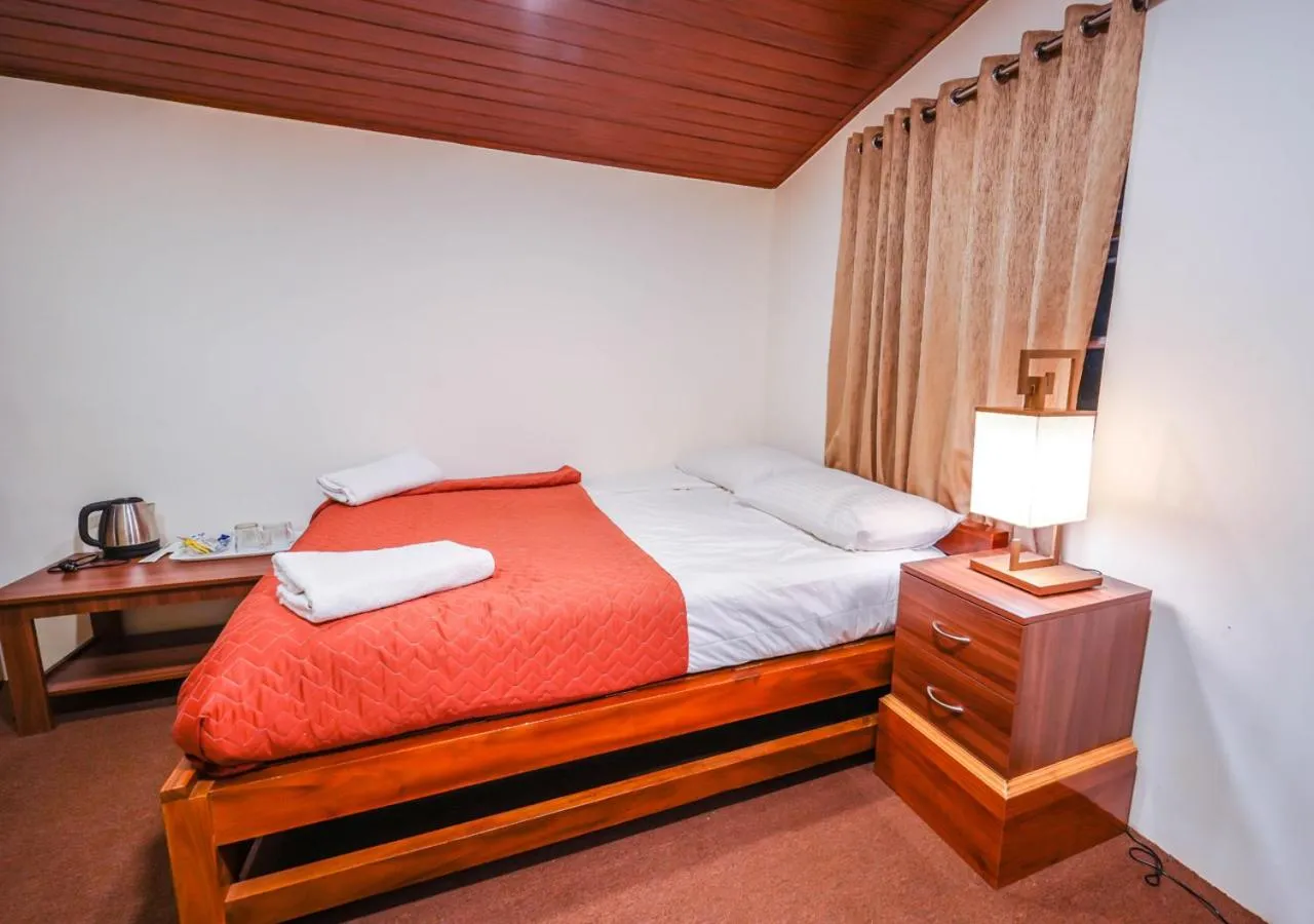 Bed in Lauriston Ooty Town Heritage Bungalow by VOYE HOMES