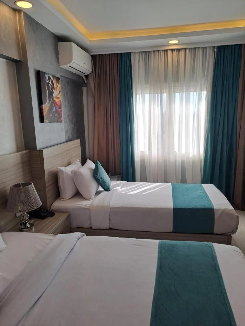 Bed in Mar Charbel Hotel Cairo