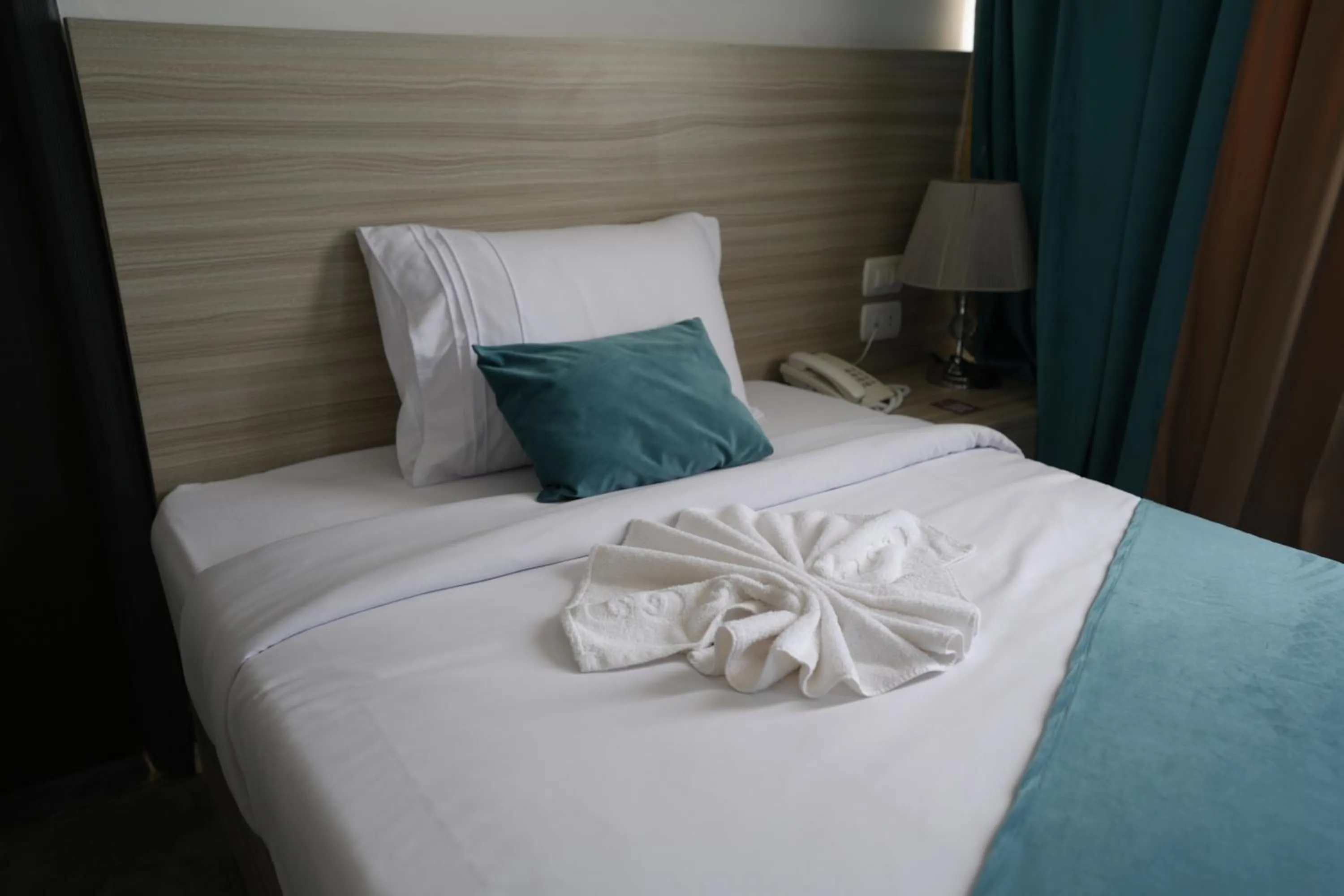 Bed in Mar Charbel Hotel Cairo