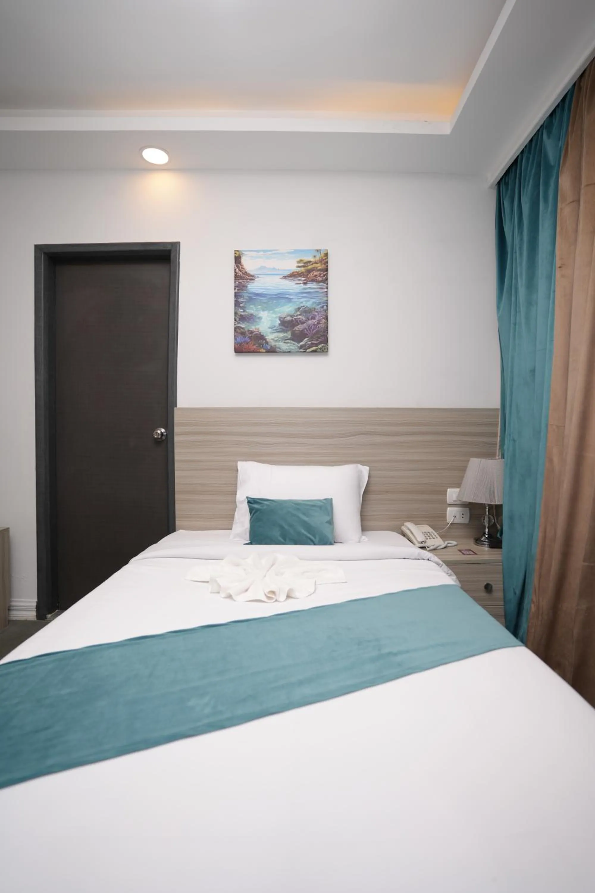 Bed in Mar Charbel Hotel Cairo