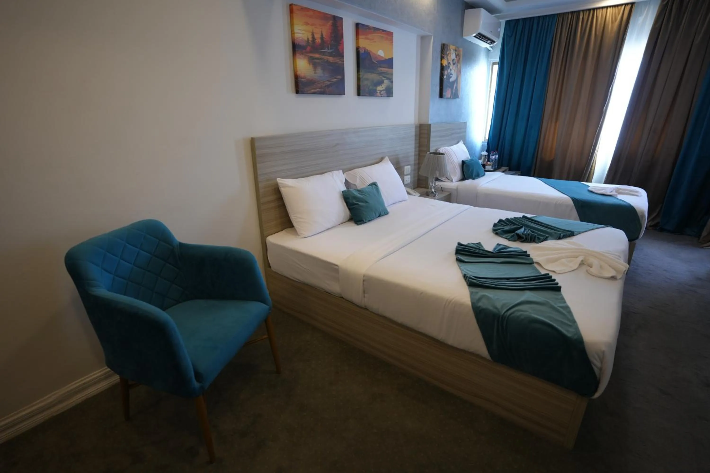 Bed in Mar Charbel Hotel Cairo