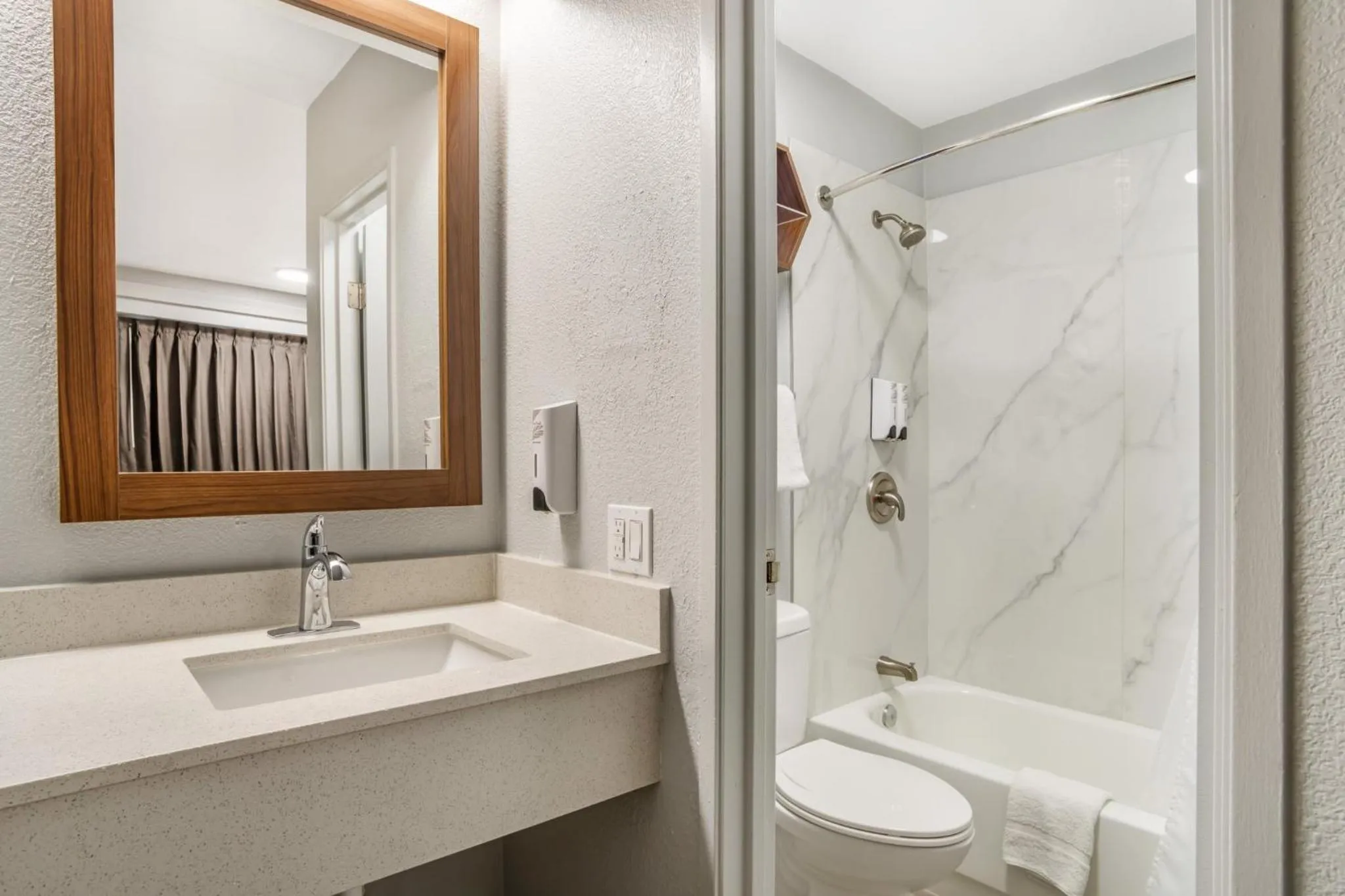 Bathroom in HomeTowne Studios by Red Roof Greenville