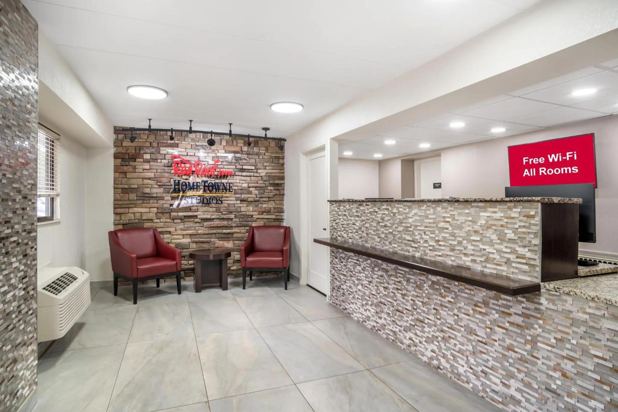 Lobby or reception in HomeTowne Studios by Red Roof Greenville