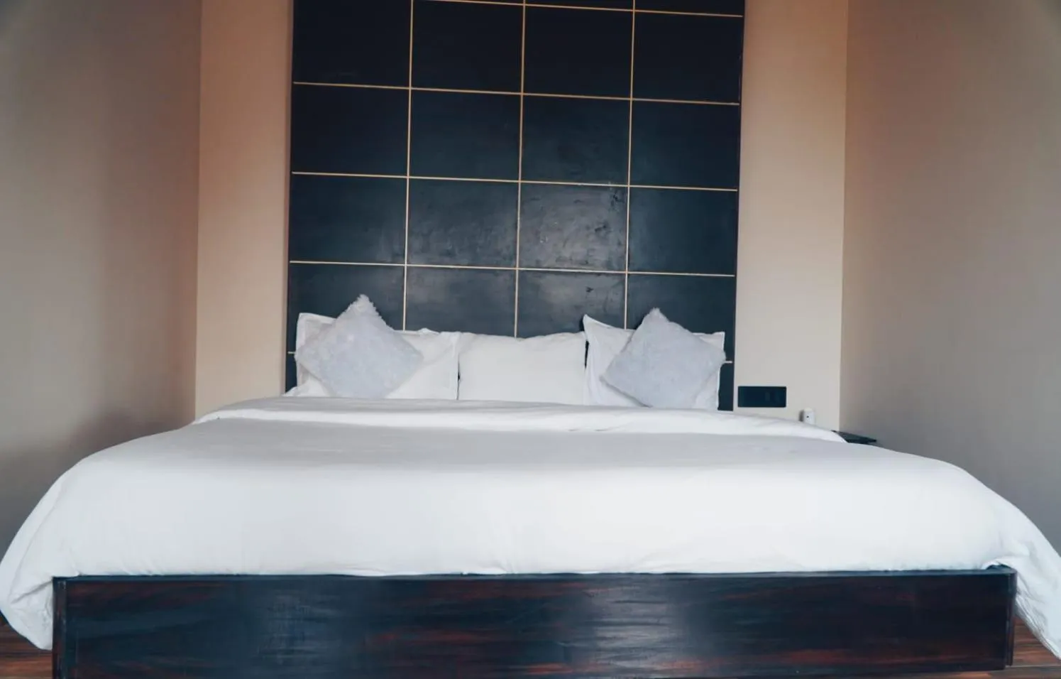 Bed in ROYALTY GLOBAL HOMESTAY