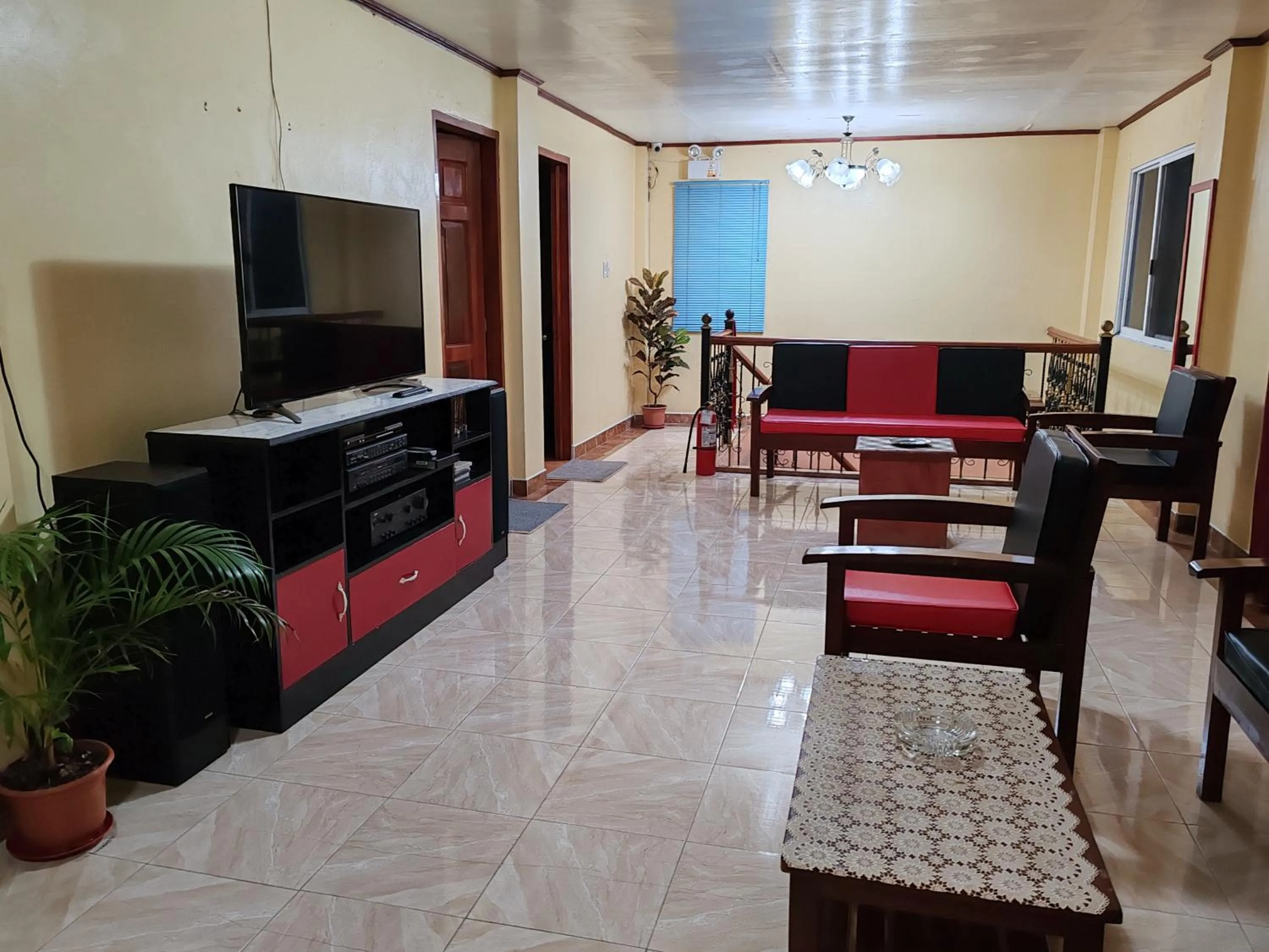 Communal lounge/ TV room in TGH Guest House Badian