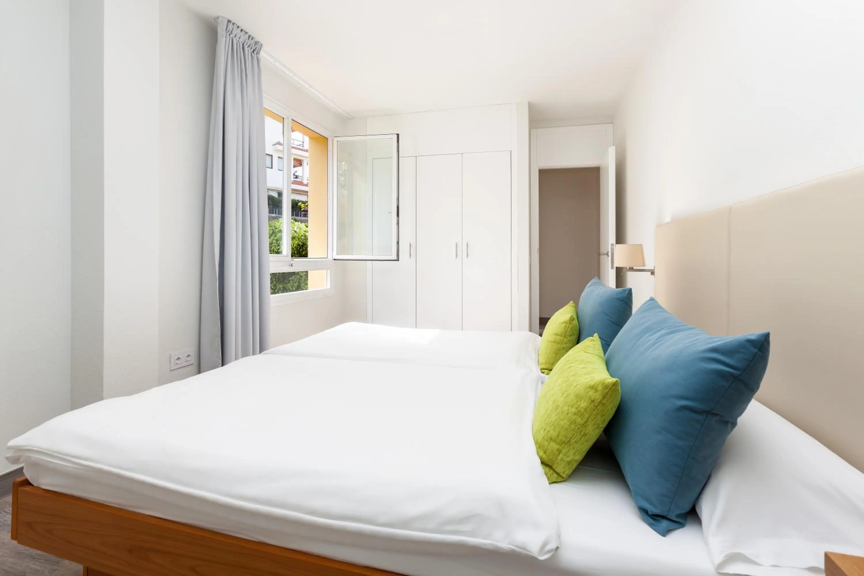 Bedroom, Bed in Apartamentos Tigaiga Suites