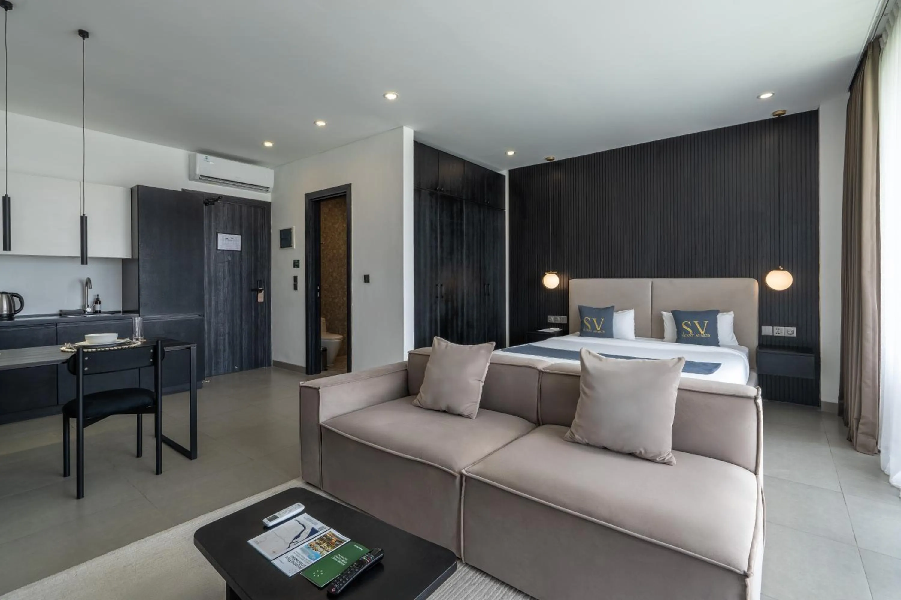 Seating area, Bed in Sunny Aparts 1 by Betterplace