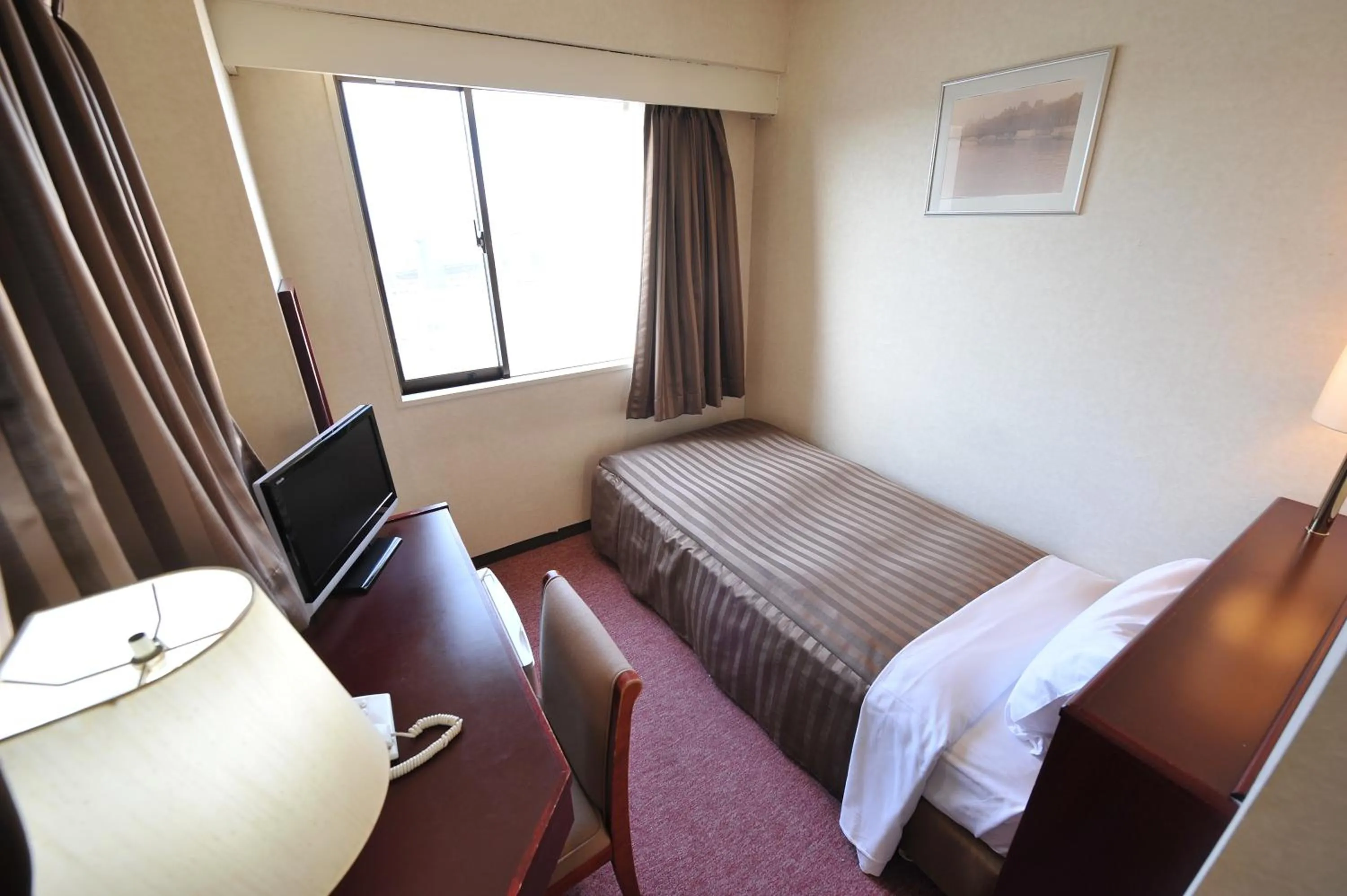 Photo of the whole room, Bed in Hotel Crown Hills Naruto