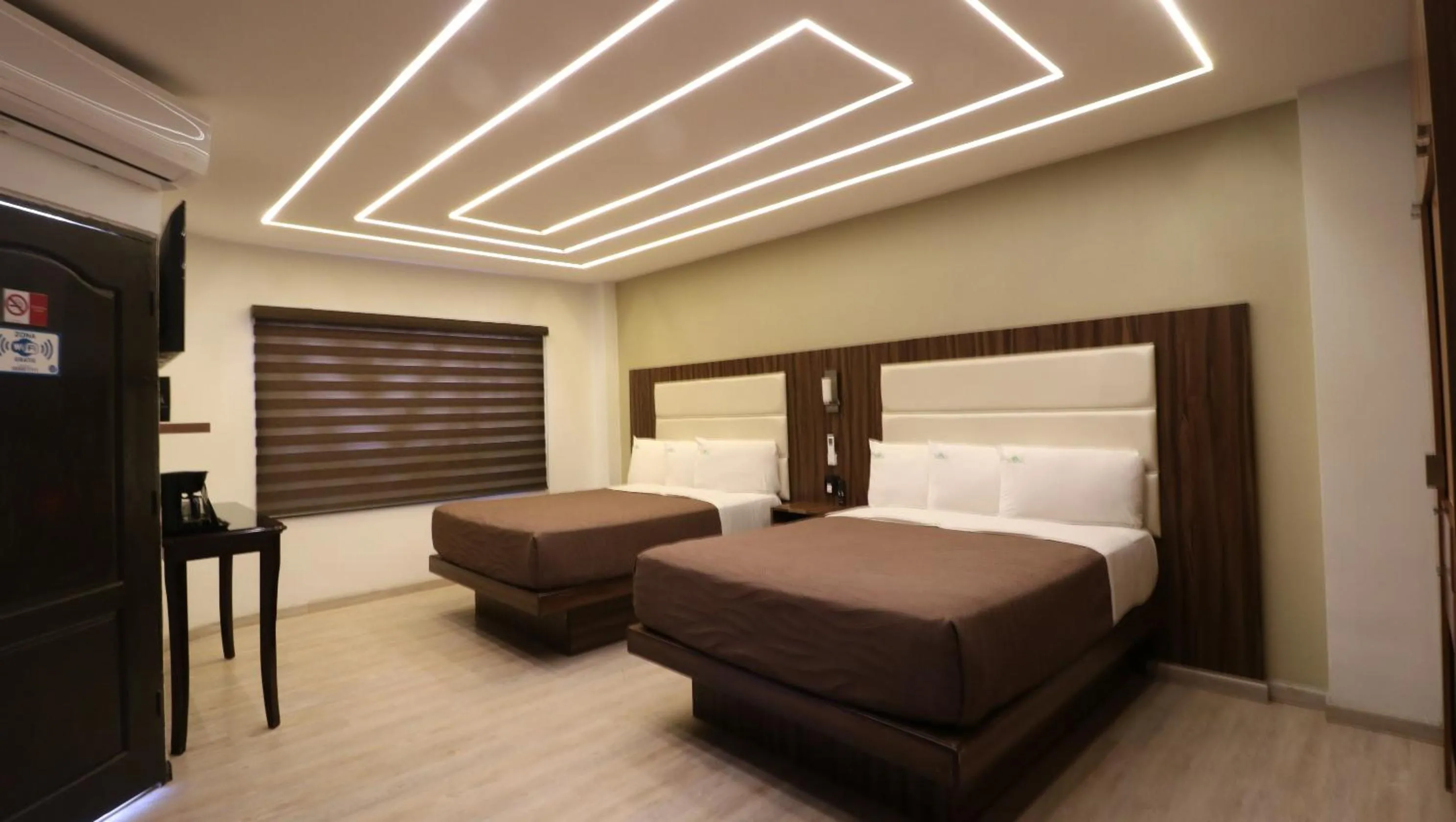Bed in HOTEL BUGAMBILIAS