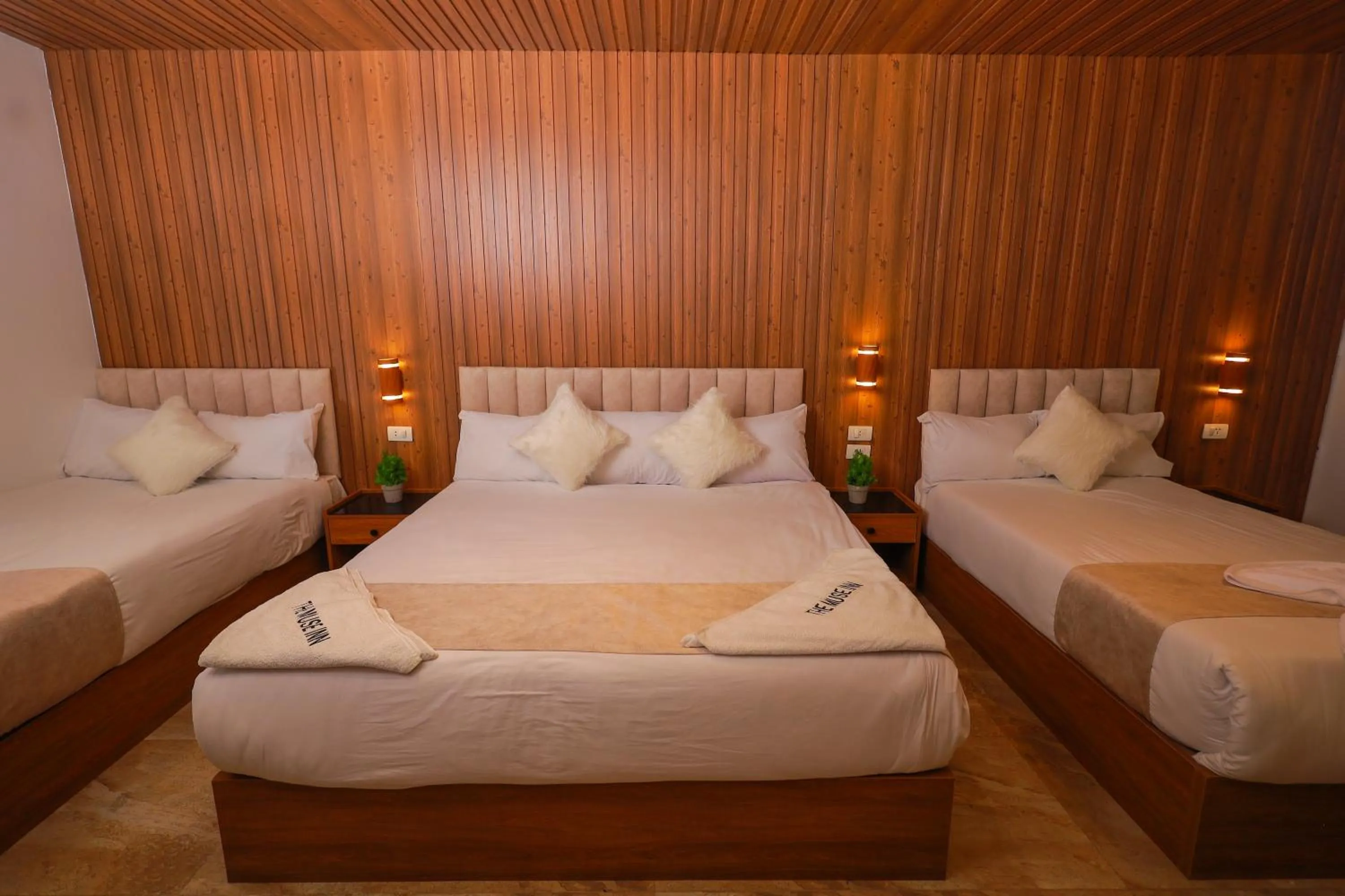 Bed in The Muse Pyramids INN