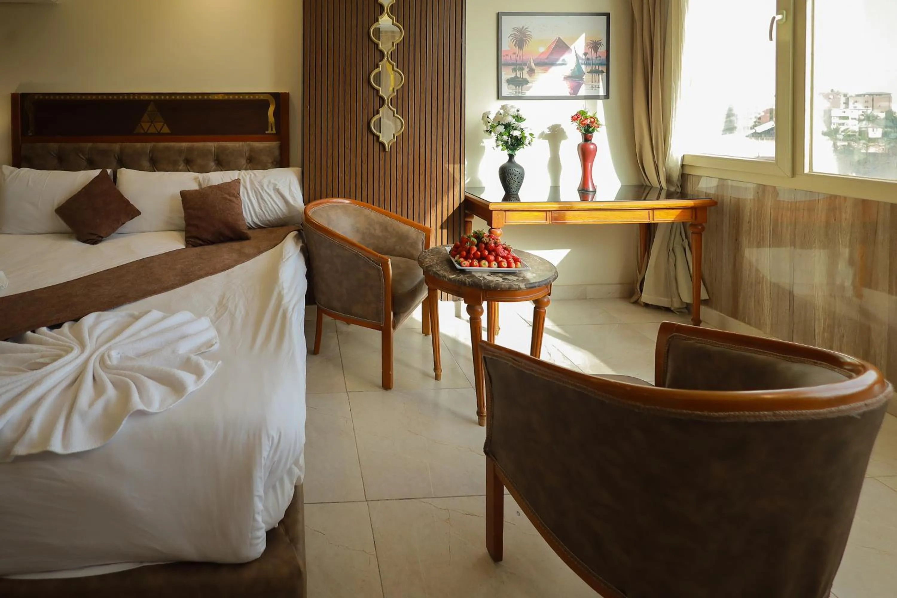 Seating area, Bed in The Muse Pyramids INN