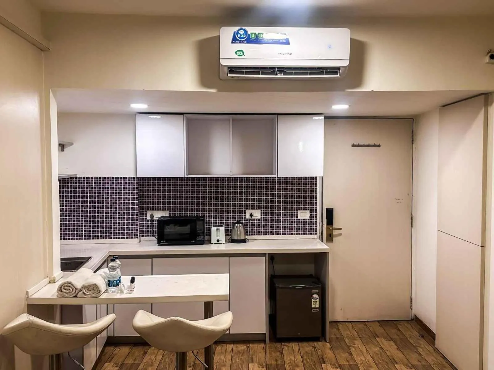 Kitchen or kitchenette in Ambition studio apartment at rajhans belliza