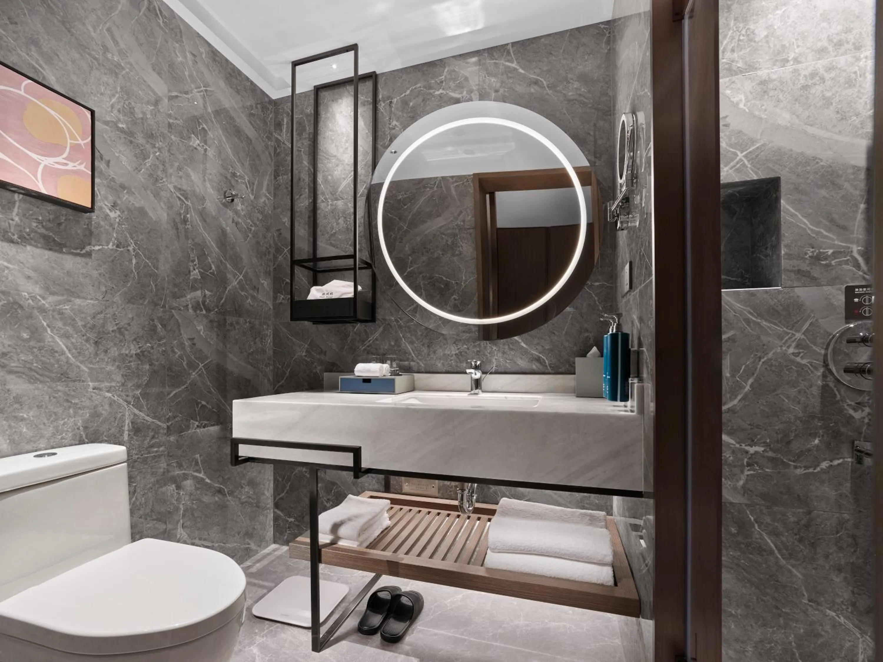 Bathroom in Doubletree By Hilton Yantai Golden Coast Hotel & Suites