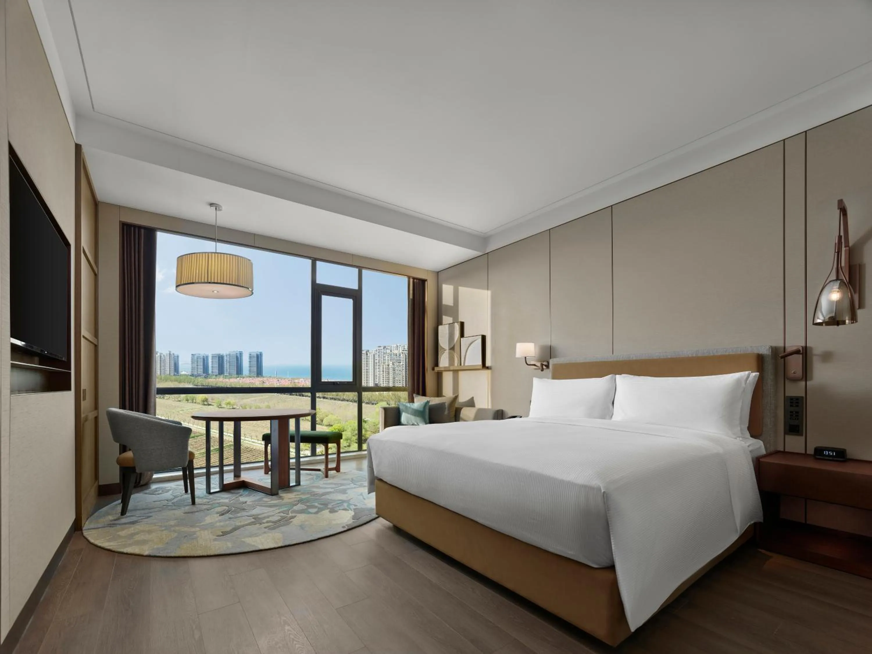 Bed in Doubletree By Hilton Yantai Golden Coast Hotel & Suites