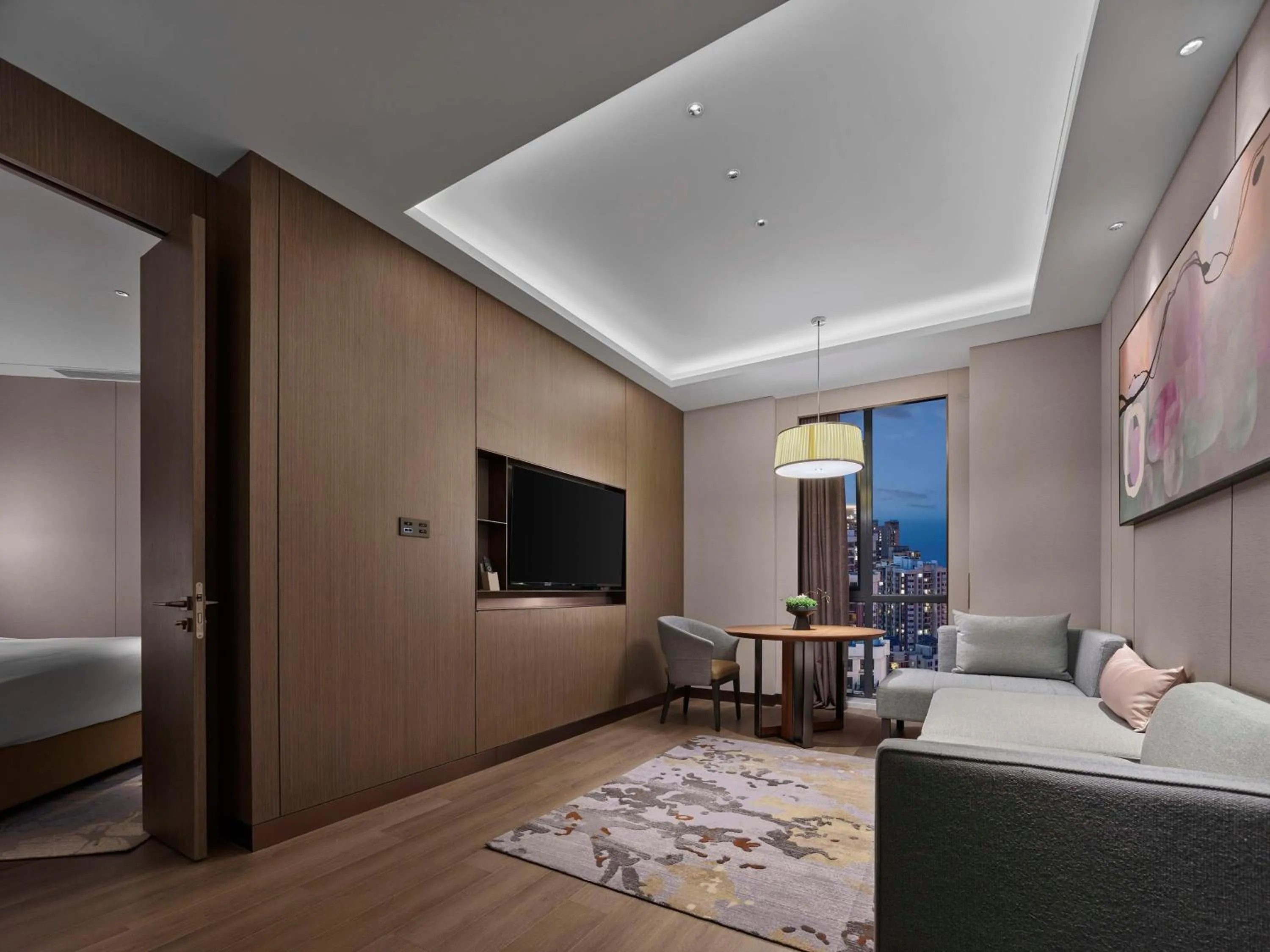 Living room, Bed in Doubletree By Hilton Yantai Golden Coast Hotel & Suites