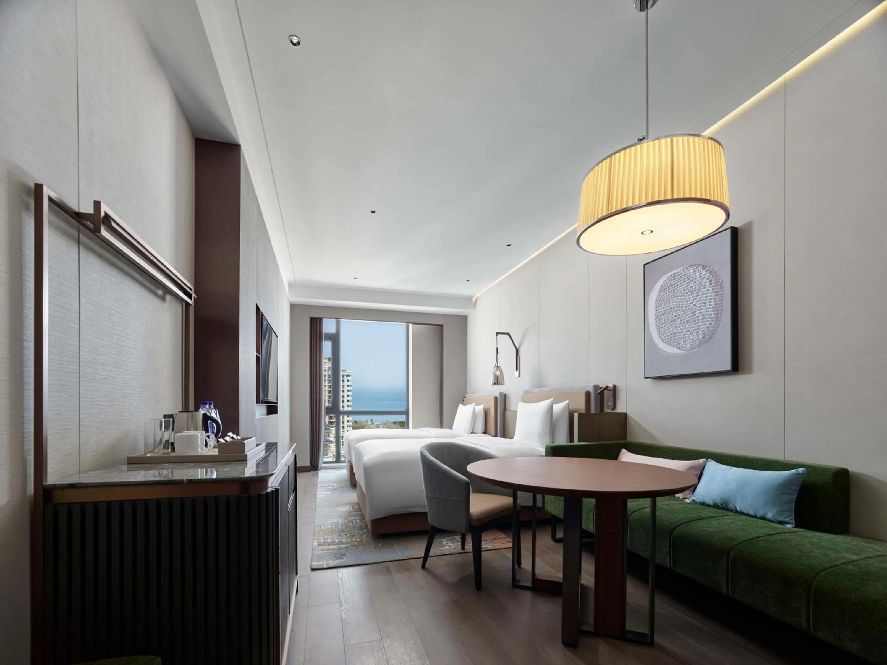 Living room, Bed in Doubletree By Hilton Yantai Golden Coast Hotel & Suites