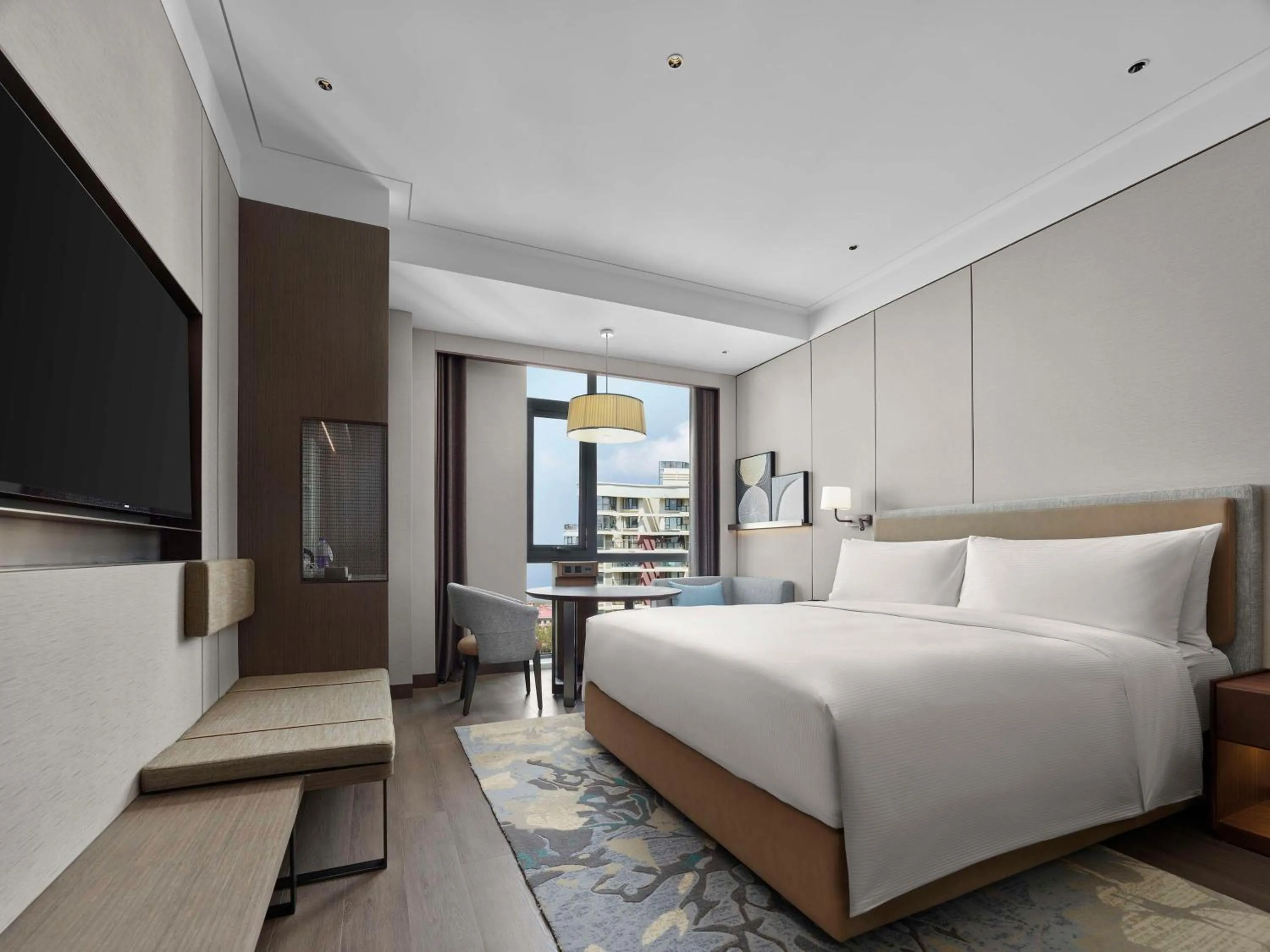Bed in Doubletree By Hilton Yantai Golden Coast Hotel & Suites