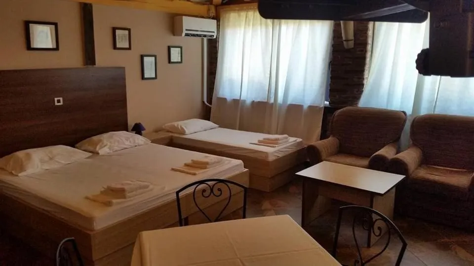 Seating area, Bed in Tribunia Beach Hotel
