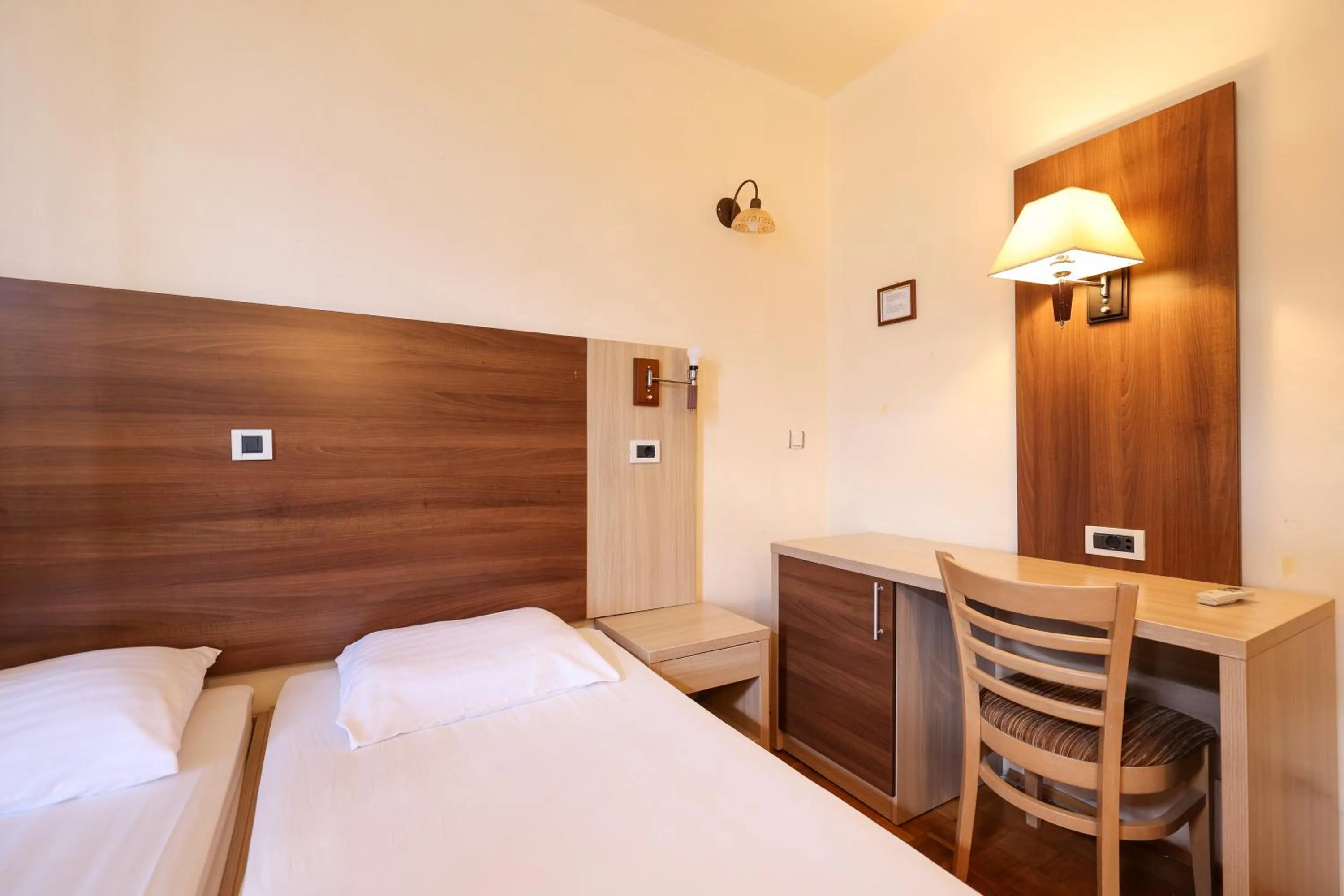 Bed in Tribunia Beach Hotel