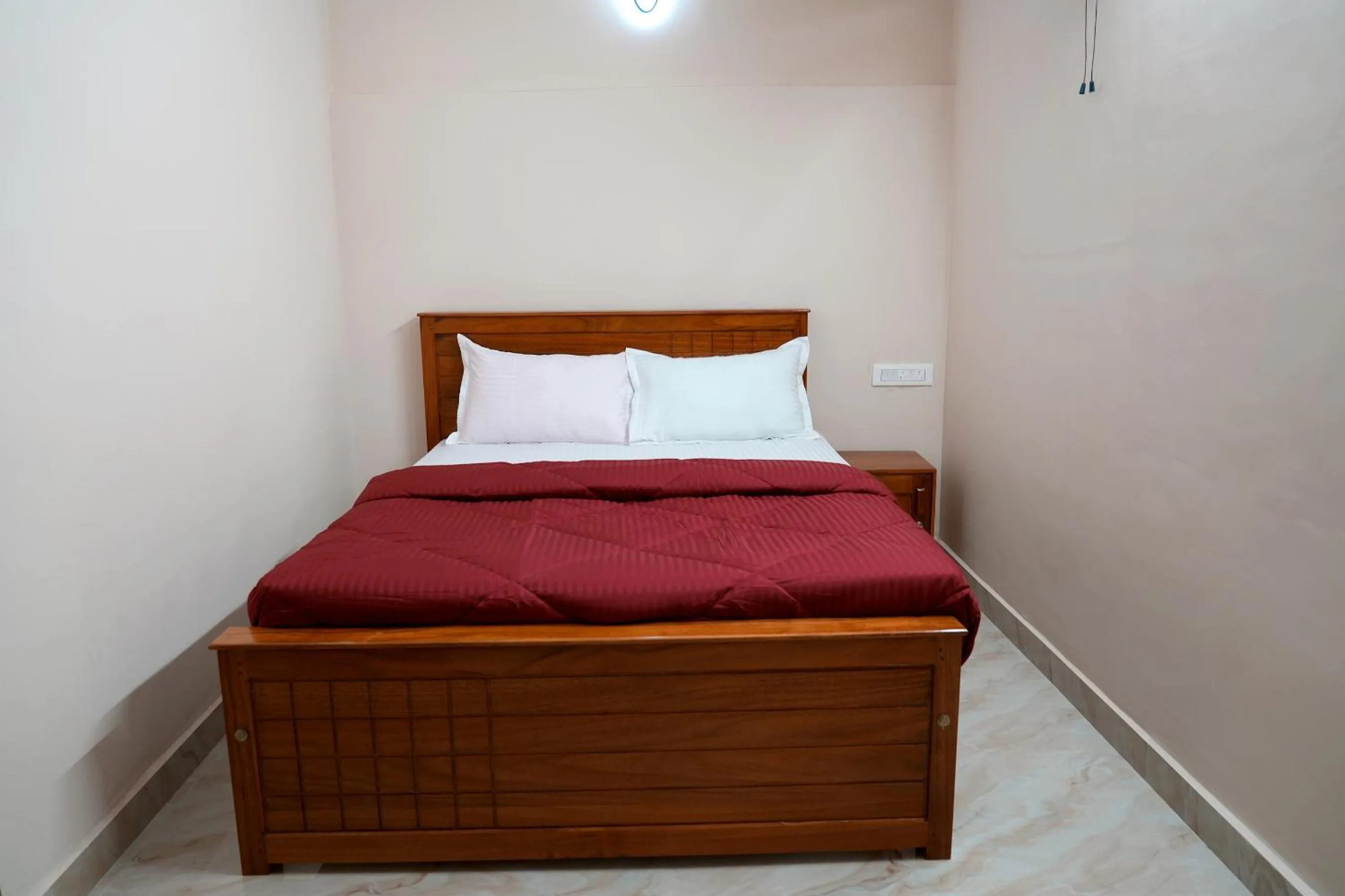 Bed in HILL PALACE RESIDENCY COORG