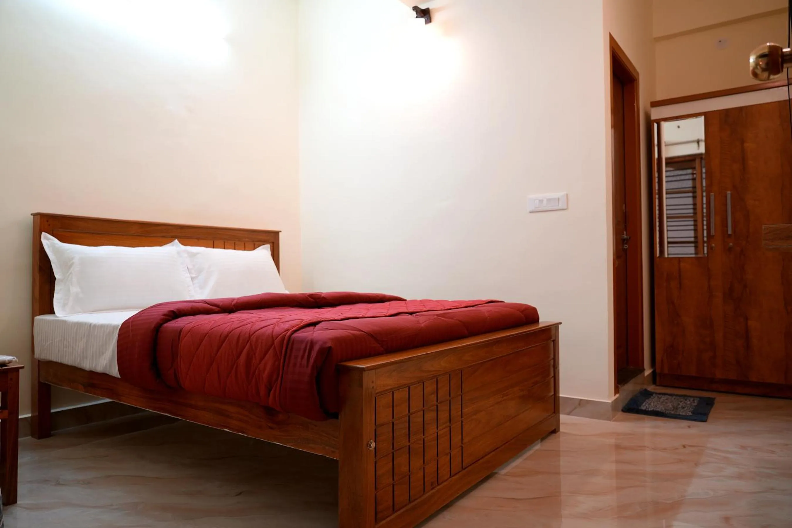 Bed in HILL PALACE RESIDENCY COORG
