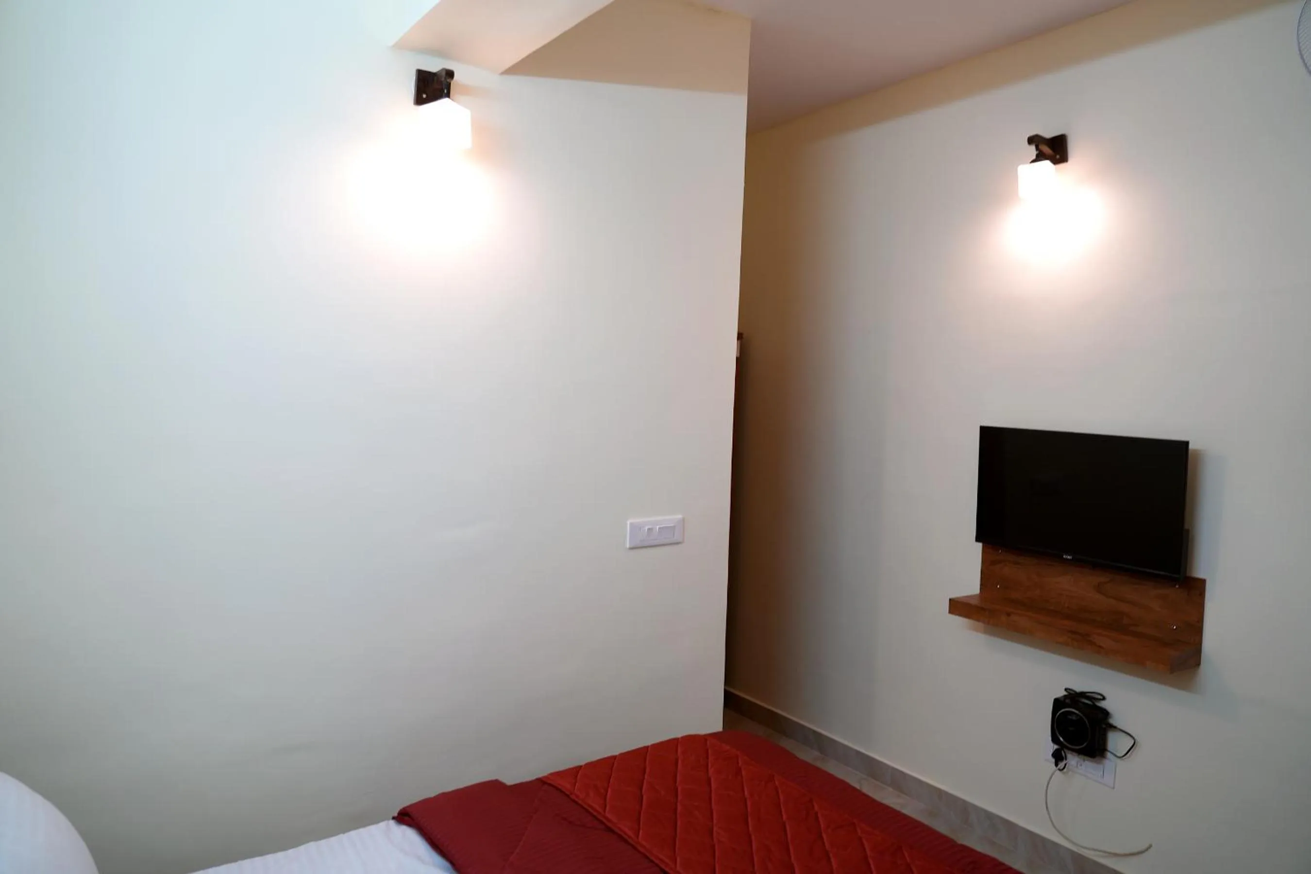 Bed in HILL PALACE RESIDENCY COORG