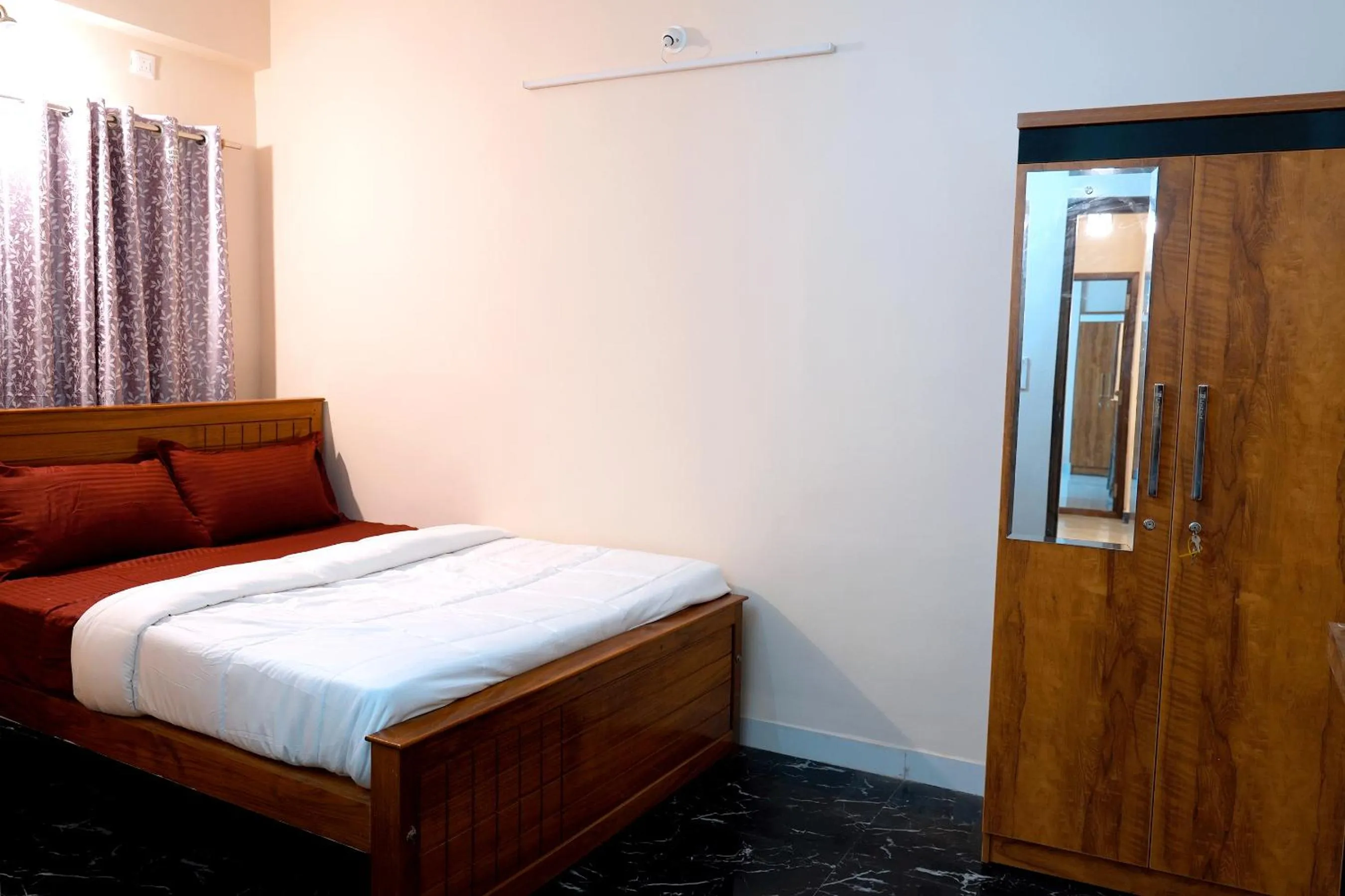 Bed in HILL PALACE RESIDENCY COORG