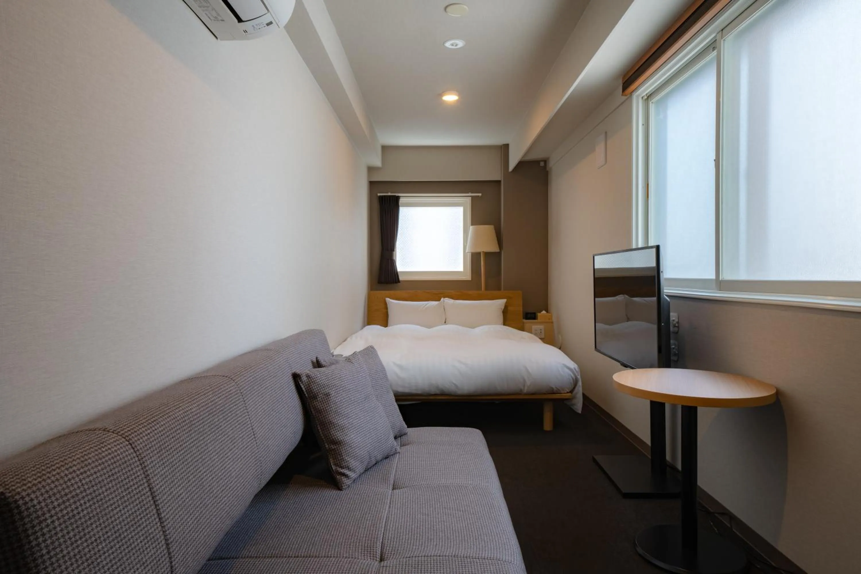 Living room, Bed in The Stay Sapporo Annex