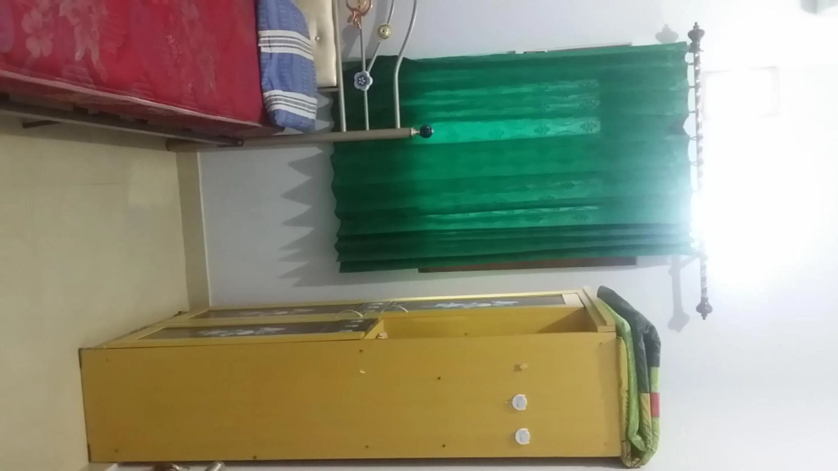 Bedroom in Hotel O Guest House Bu Iin Syariah