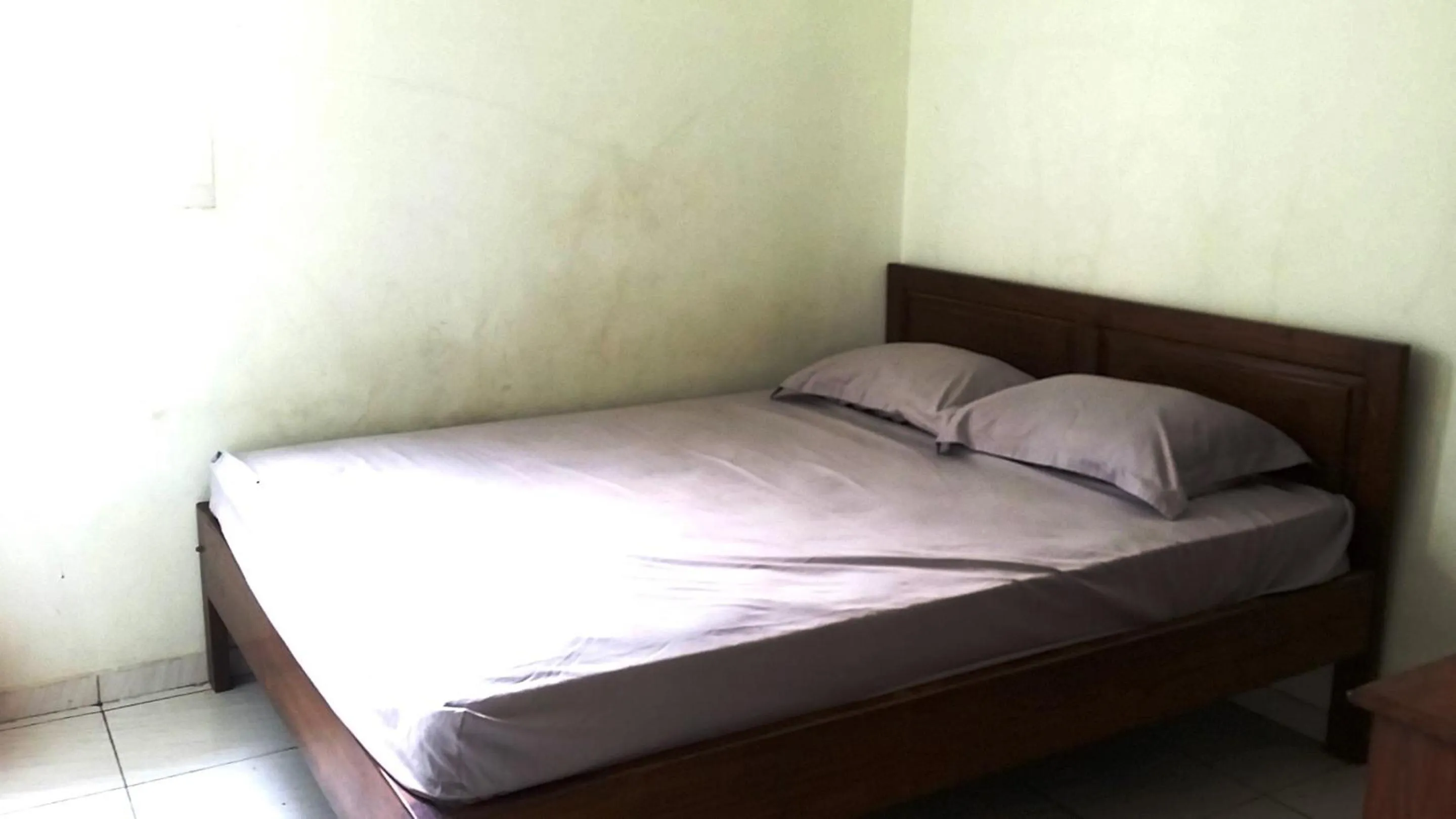 Bedroom, Bed in Hotel O Guest House Bu Iin Syariah