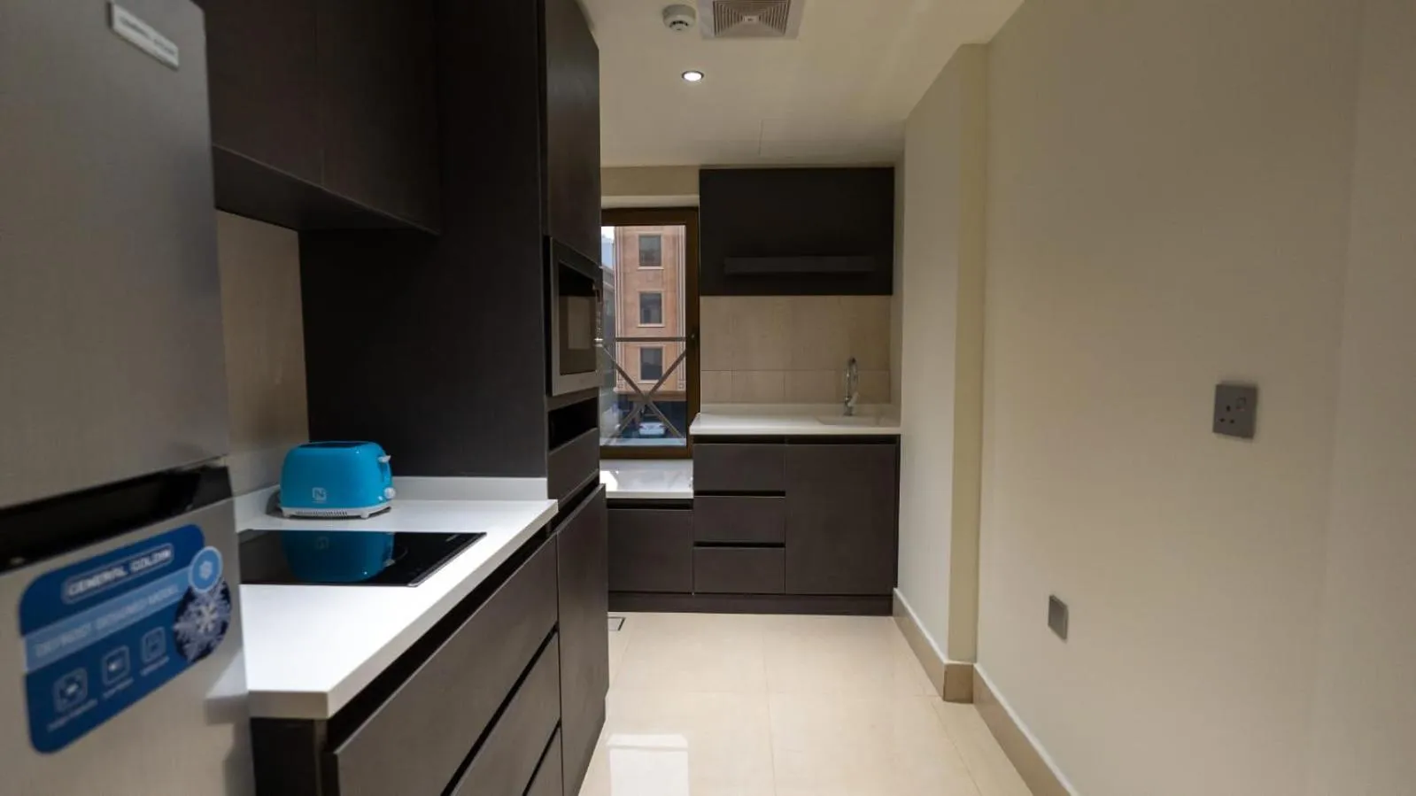 Kitchen or kitchenette in Maskan Alolya Serviced Apartment