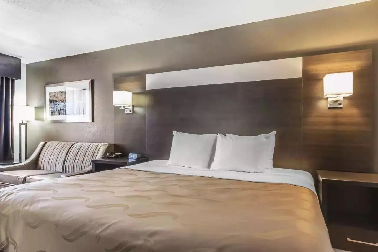Bed in Quality Inn and Suites