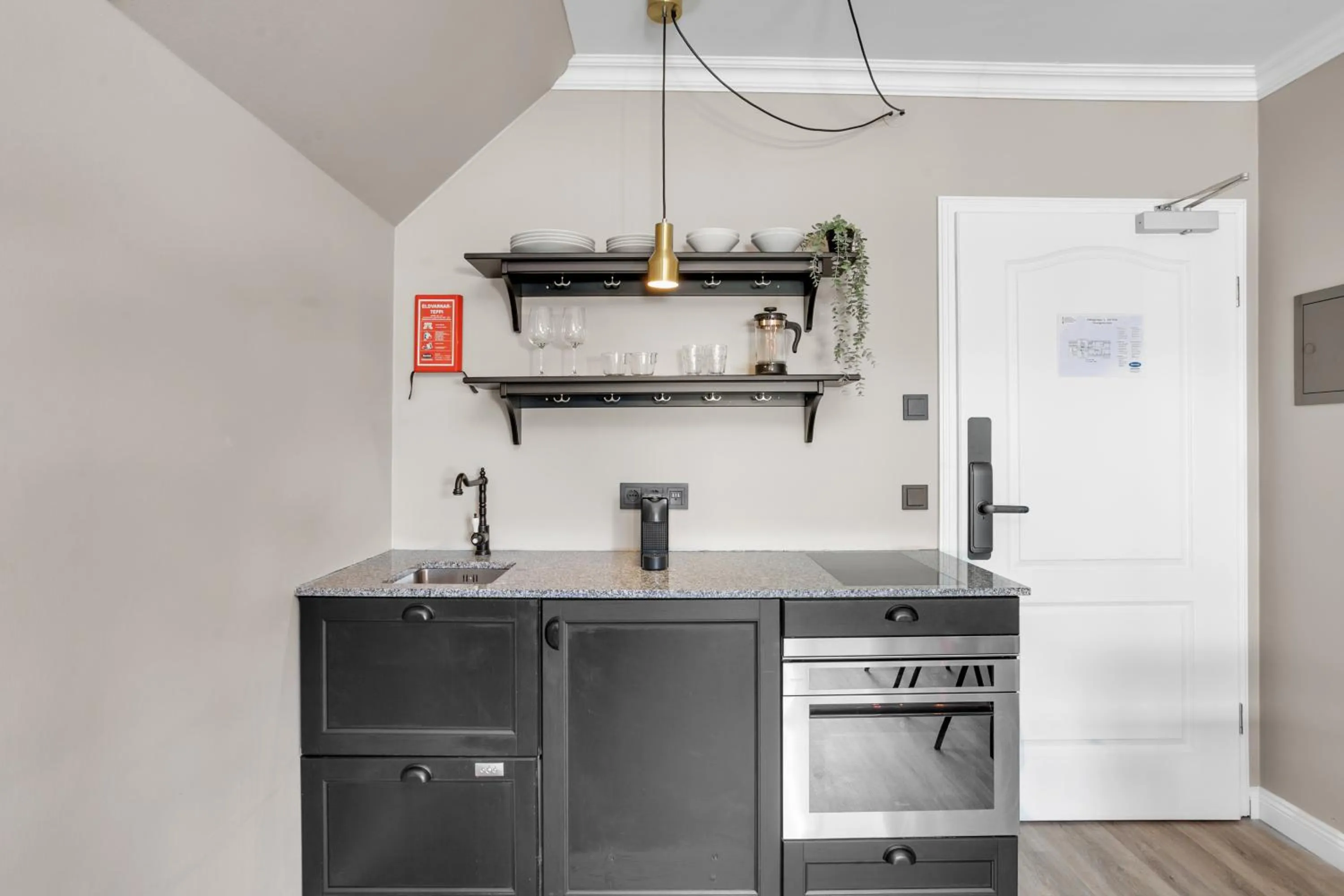 Kitchen or kitchenette in ODDSSON Downtown Hotel