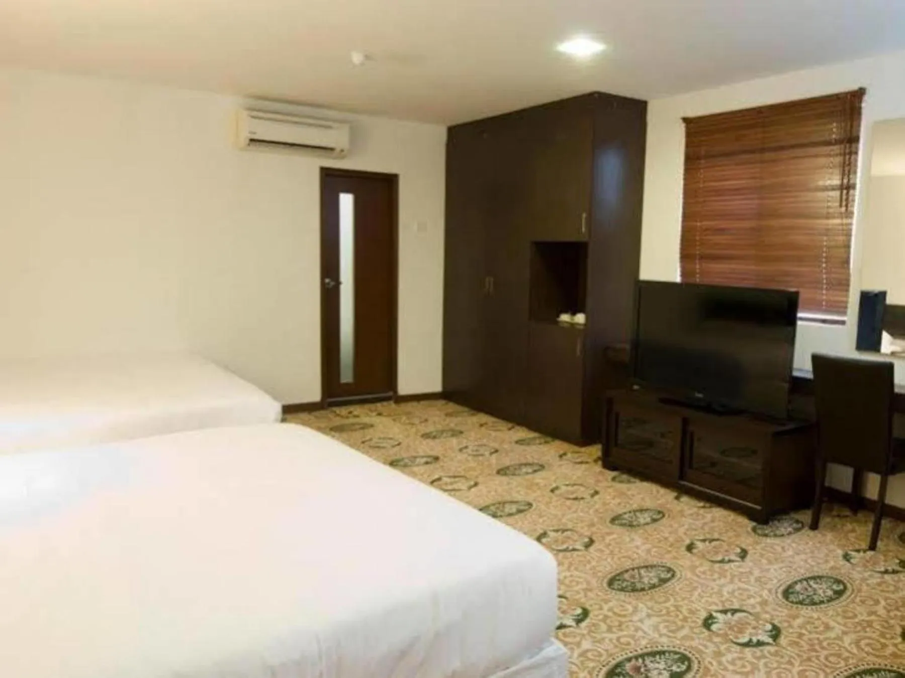 Bed in Syaz Meridien Hotel